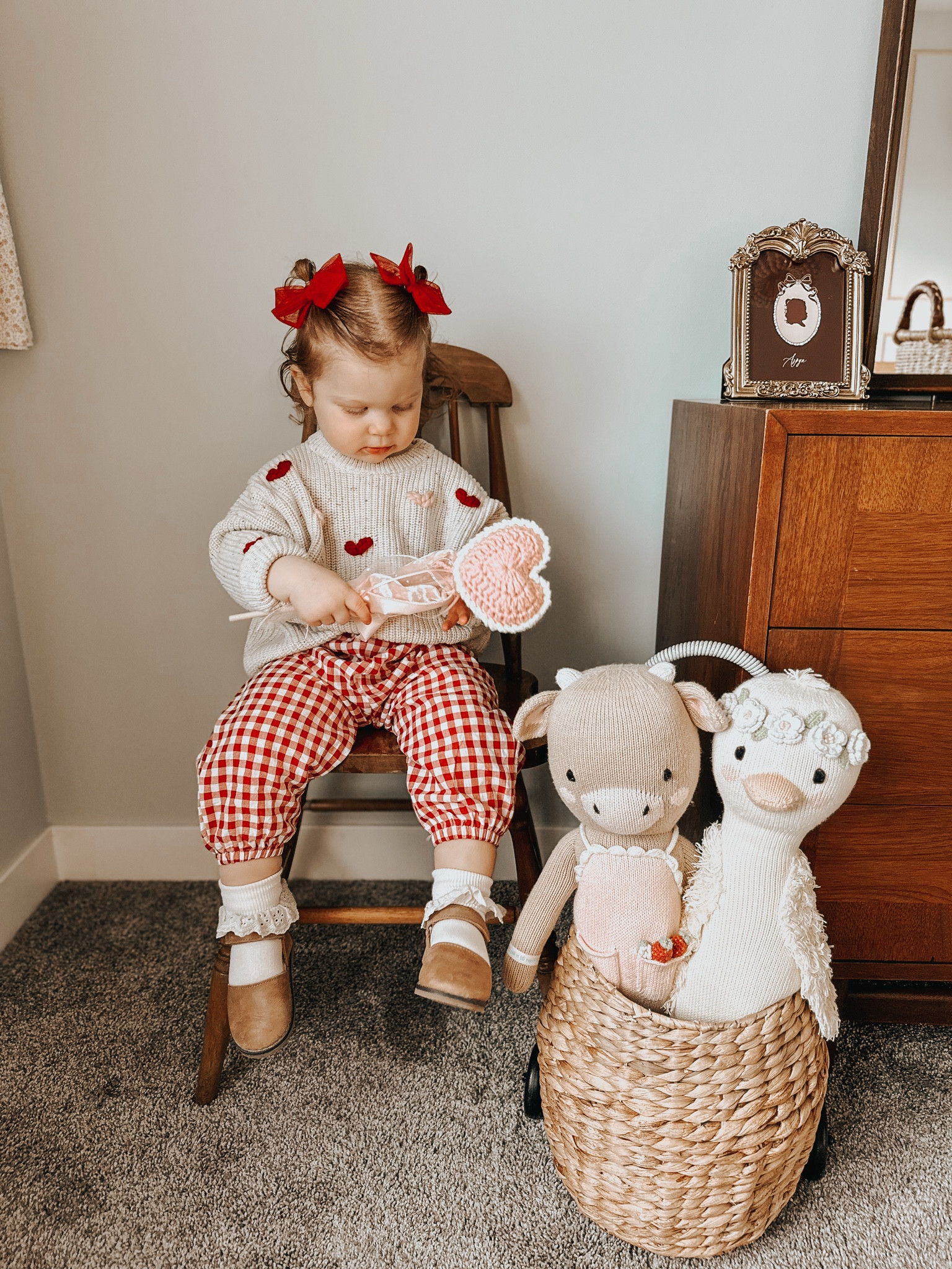 toddler girl Valentine’s Day outfit idea! these gingham pants add such a fun touch to the look! linked the exact sweater and pants, everything else are similar items. exact shops are tagged on instagram. 
-sweater discount: ‘occurringwitholivia’ 
-shoes discount: ‘olivia15’ works, -cuddle and kind 20% off discount link is in my ig bio! 

baby girl, toddler girl , outfit ideas for toddlers, baby bows, toddler hairstyle idea, vday, love basket 

#LTKKids #LTKBump #LTKBaby