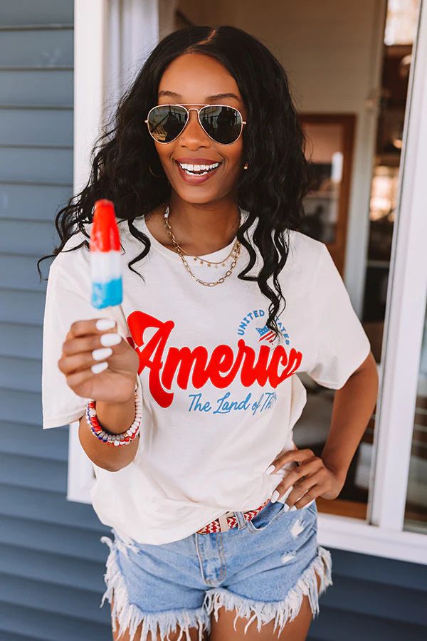 The Land Of The Free Graphic Tee | Impressions Online Boutique