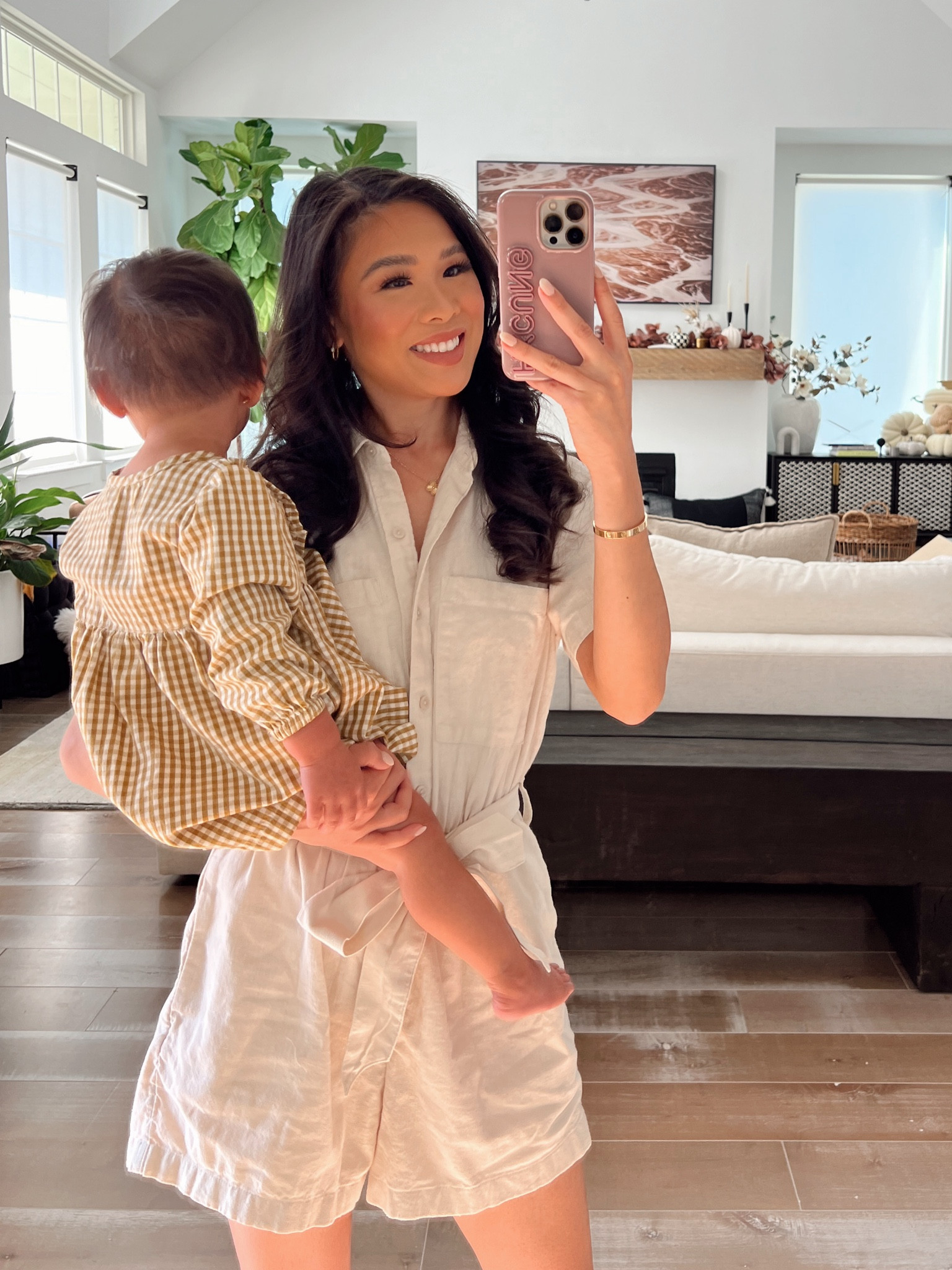 Beige romper that’s nursing and pumping friendly. Wearing size petite XS and love how it has pockets. Linking my dainty hoop earrings and entryway decor, too  