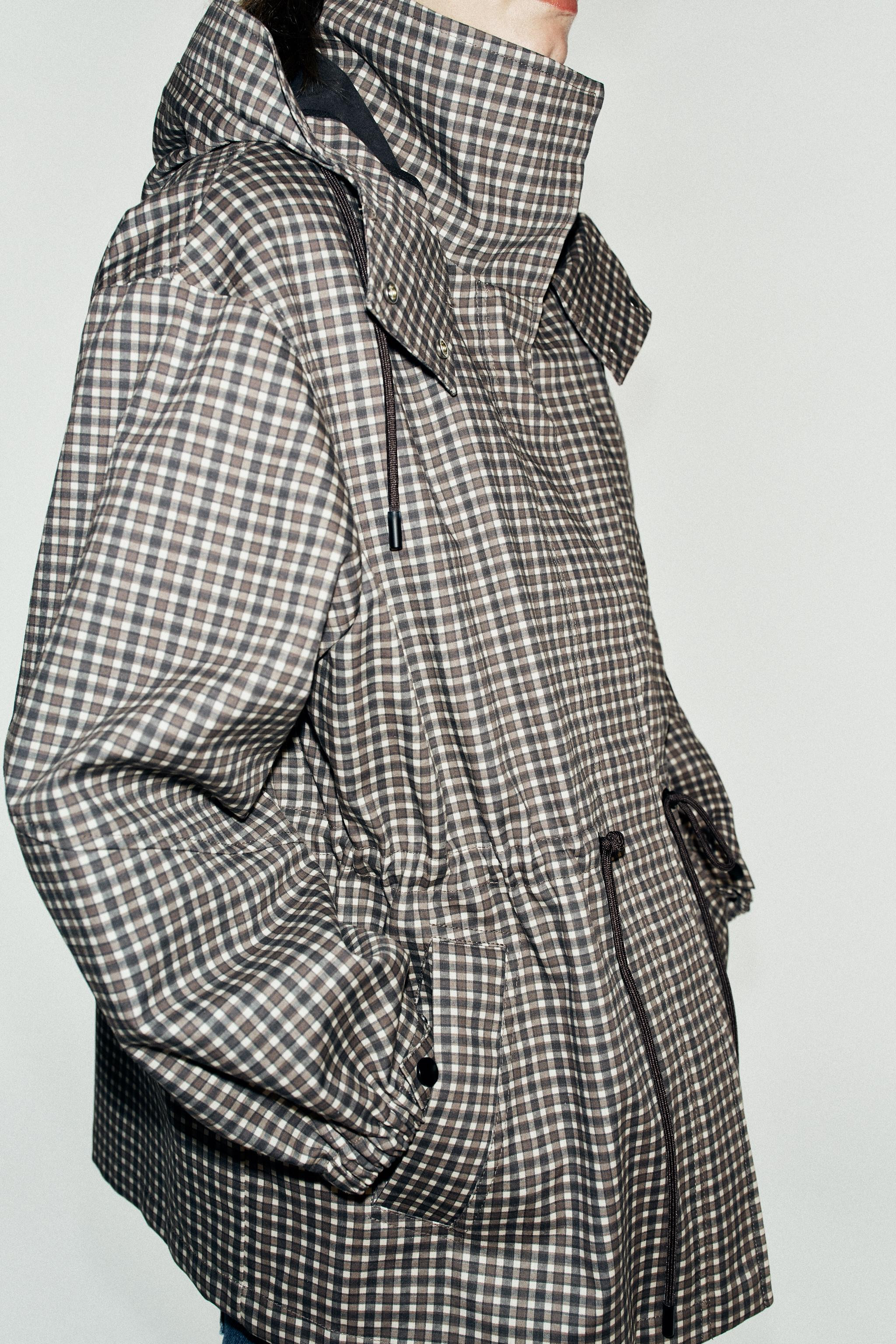 Stand-up collar jacket featuring an adjustable drawstring hoodie and long sleeves with elasticize... | Zara US