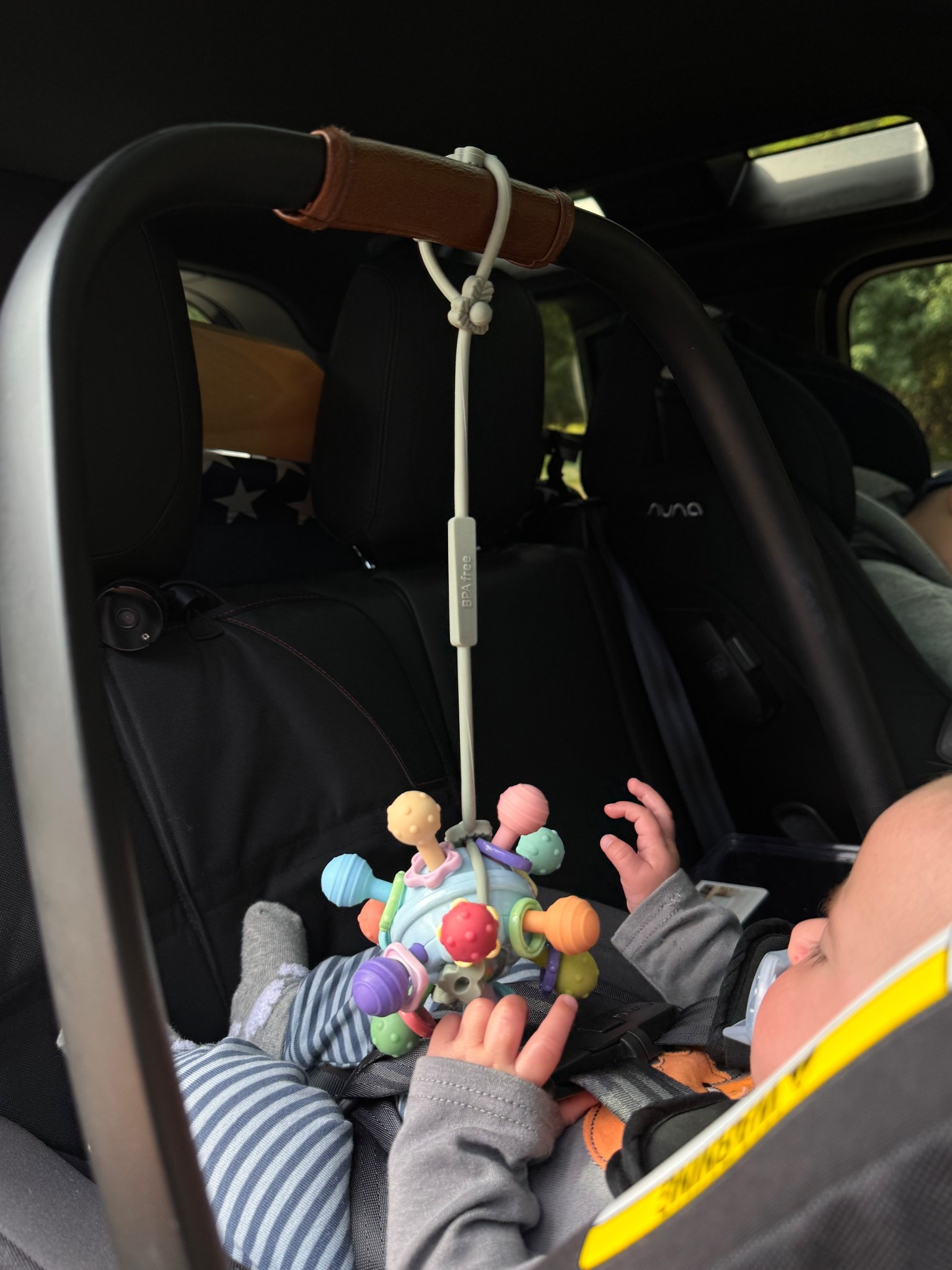 On the go toy idea for the car seat!  These silicone strings have  come in handy when in the stroller so we don’t lose any toys. #LTKbaby