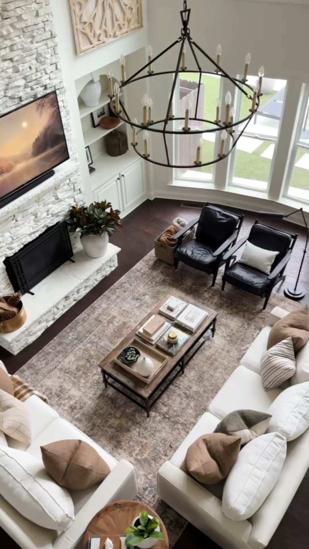 This time of year, I love to have a warm neutral living room, with lots of textures and subtle colors. home decor living room decor brown pillows plaid throw alabaster walls iron chandelier neutral décor

#LTKHome #LTKSeasonal