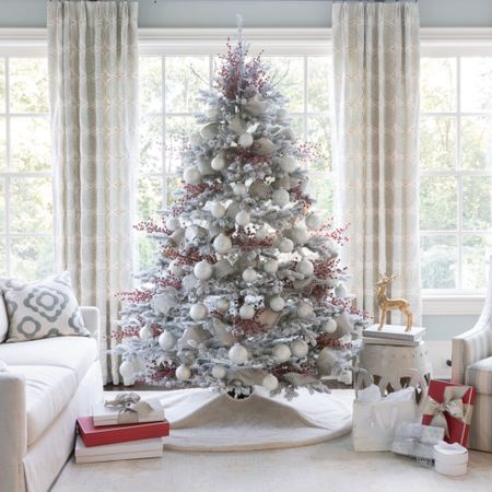 A flocked Christmas tree with red berries, white ornaments and silver glitter ribbon. A perfect winter wonderland tree!


#LTKHoliday #LTKSeasonal #LTKHolidaySale