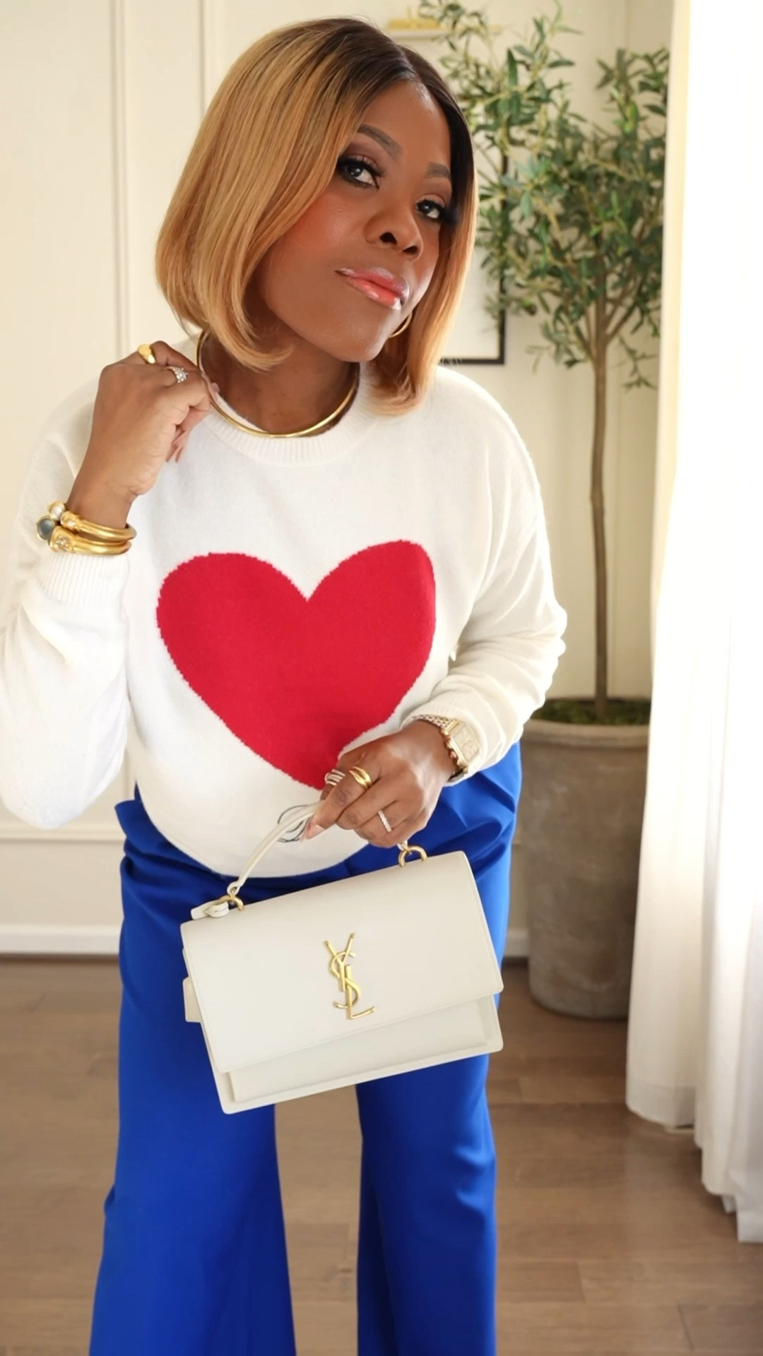 A touch of Valentine’s Day for everyday outfit. Heart sweater , blue pants , YSL bag , skims brush 

#LTKMidsize #LTKValentine #LTKWorkwear
