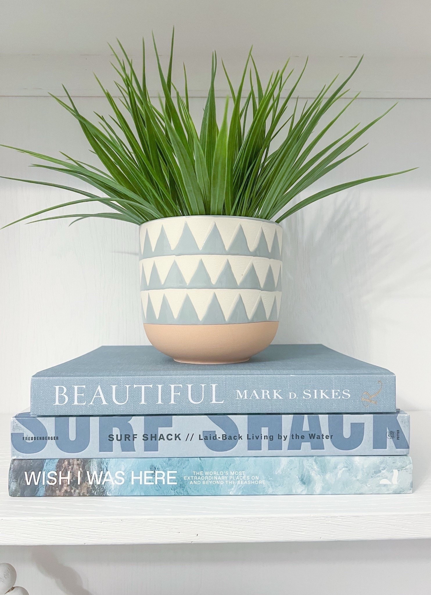 These three coastal coffee table books look so pretty stacked together! Whether you're just looking to add some color or some height, this trio is one of my favorite combinations. Planter has been discontinued, so unable to link.
-
amazon coffee table books, amazon home decor, shelf styling, blue books, blue decor, coastal home decor, coastal style, beach house decor, lake house decor, beach house style, bookcase decor, built-in decor, bookshelves, surf shack, beautiful, wish i was here, blue and white home decor, coffee table book combinations


#LTKHome