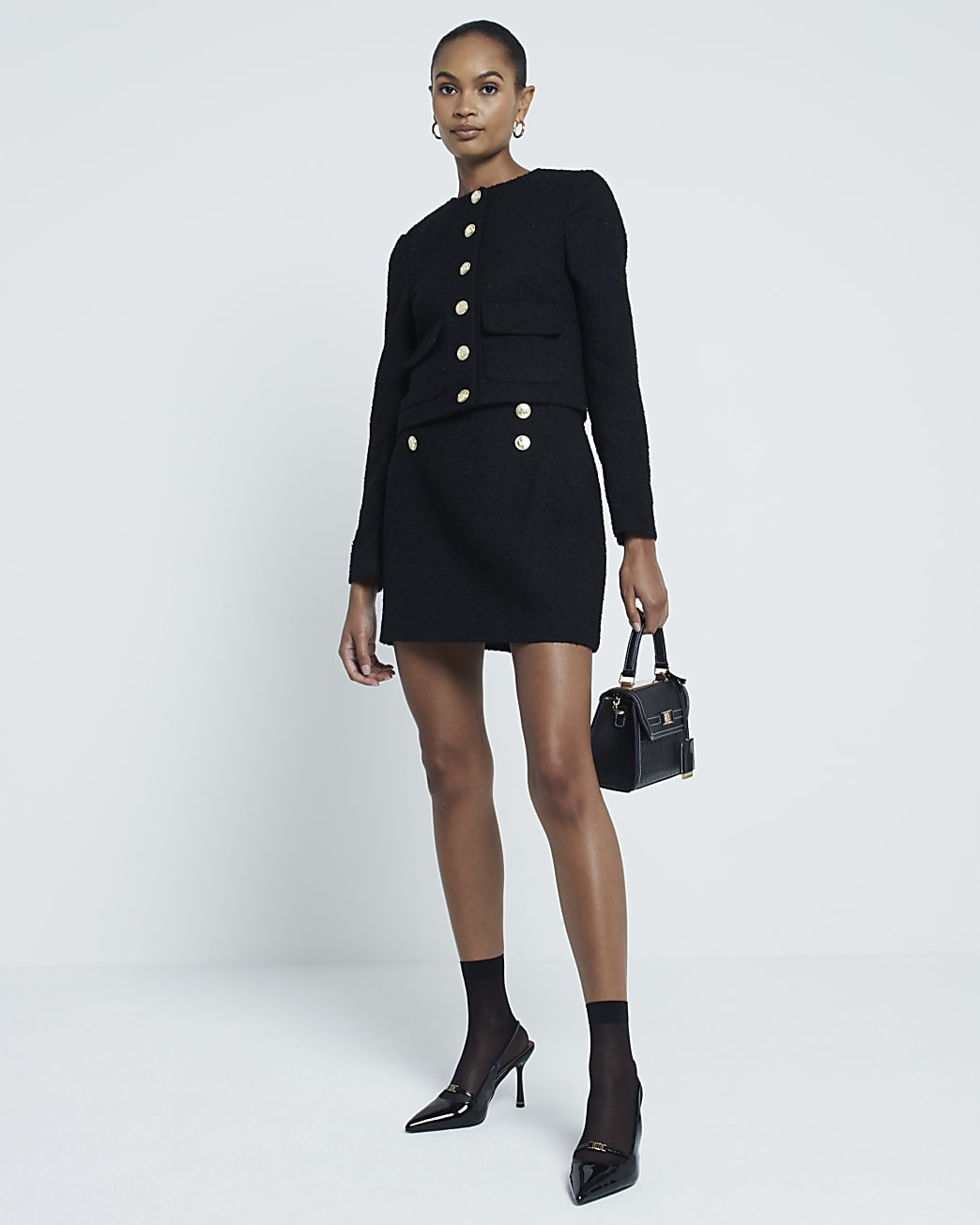 Black boucle button detail mini skirt | River Island UK & IE