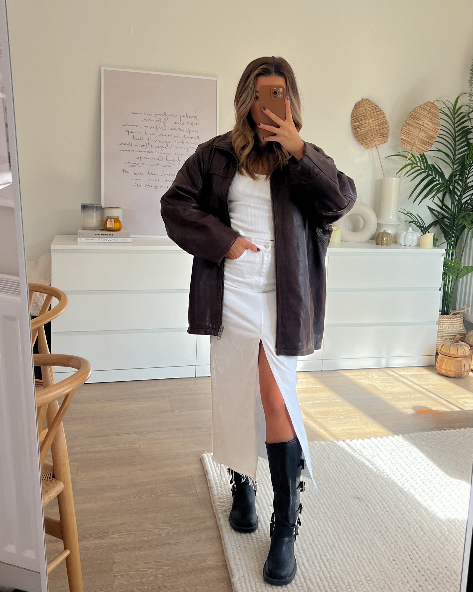 Oversized brown leather jacket styled with white scoop vest and white denim maxi skirt. Black biker boots from ego 

#LTKfindsunder100 #LTKCyberWeek #LTKshoecrush
