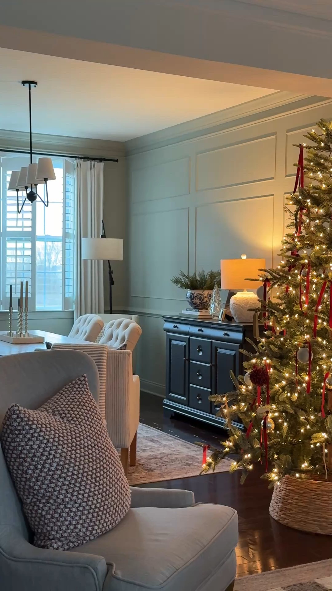  The Christmas glow has entered our home.  

Christmas tree
Velvet Ribbon
Dining room chandelier
Floor lamp
Table lamp
Tree skirt
Accent chairs 
Glass tree
Christmas stems
Blue pottery vase

#LTKHoliday #LTKSeasonal #LTKHome