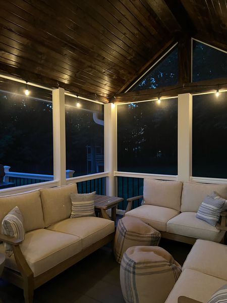 Ashley Clare Outdoor Wooden Loveseat on Sale. We love our outdoor living decor and space. Screened-In Porch Ideas | outdoor string lights  | outdoor poufs

#LTKhome #LTKsalealert #LTKSeasonal