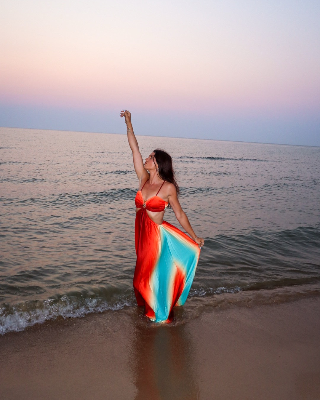 Flowing through golden hour in the dreamiest sunset maxi 🌅✨ This ombré cut-out dress is giving tropical goddess energy with its bold red, orange, and turquoise blend. The twisted front and breezy fabric make it perfect for beach vacations, summer weddings, or any warm night when you want to make a statement.

🔗 Linked on LTK
#LTKsummer #LTKsunsetstyle #BeachStyle #VacationOutfit #MaxiDress #CutOutDress #LTKfinds #SunsetGlow #WhatToWearOnVacation