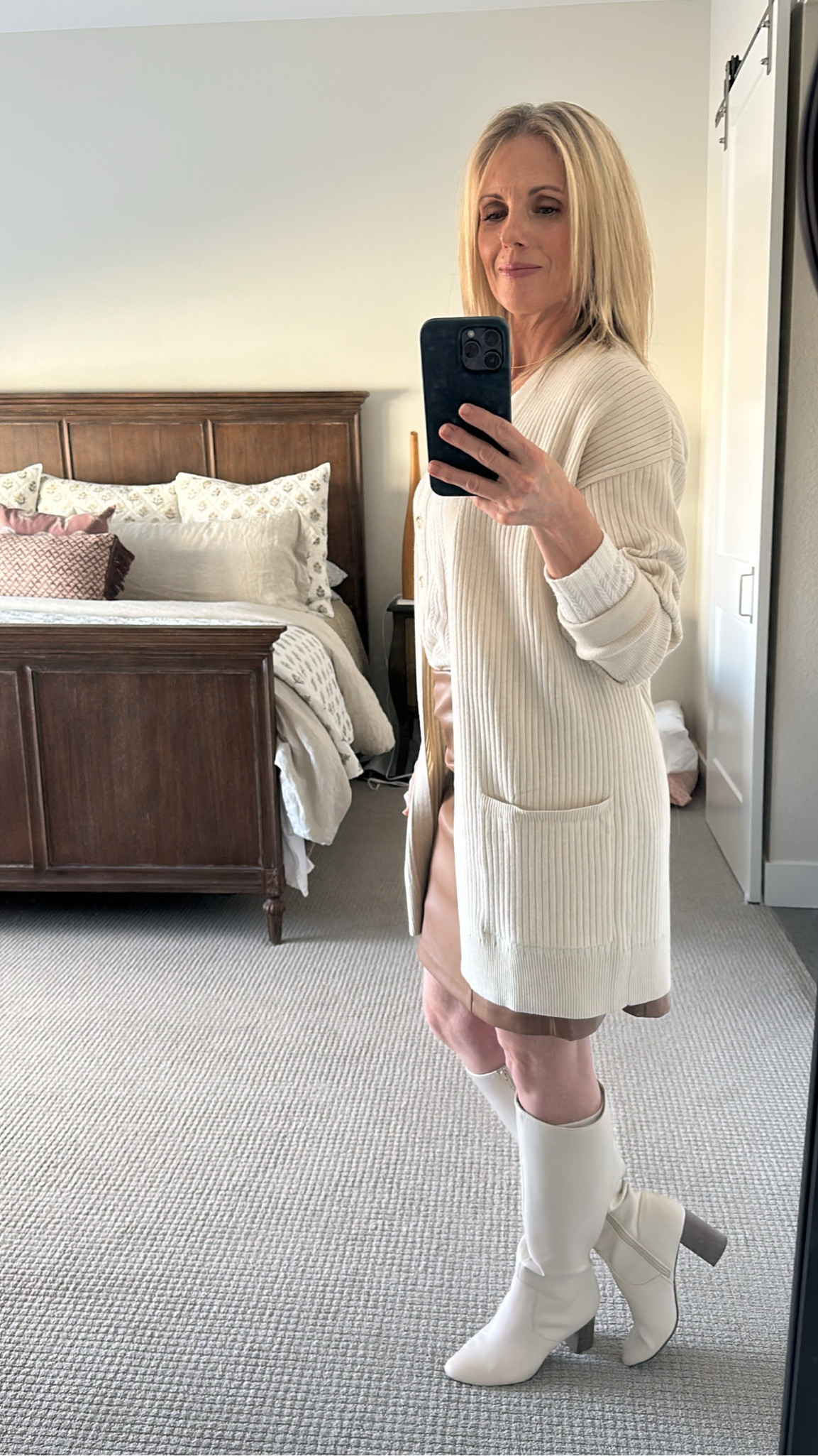 Cream cardigan, faux leather skirt, tall boots #vitality

#LTKfindsunder100