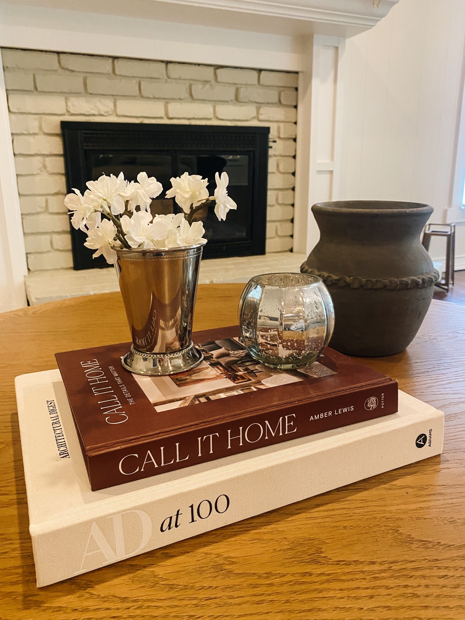 Coffee table decor on prime day! Snag the perfect coffee table books and this Julip cup I use as a vase. #homedecor #coffetabledecor 

#LTKHome #LTKSaleAlert #LTKFindsUnder100