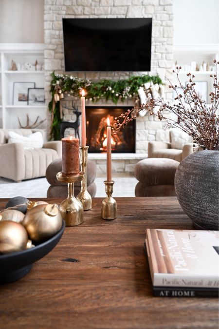 Simple coffee table decor for the holidays! 🌲

Coffee table decor. Books. Candles. Brass candles. Holiday stems. Holiday floral. Ornaments. Bowl. Vase  

#LTKhome #LTKHoliday #LTKSeasonal