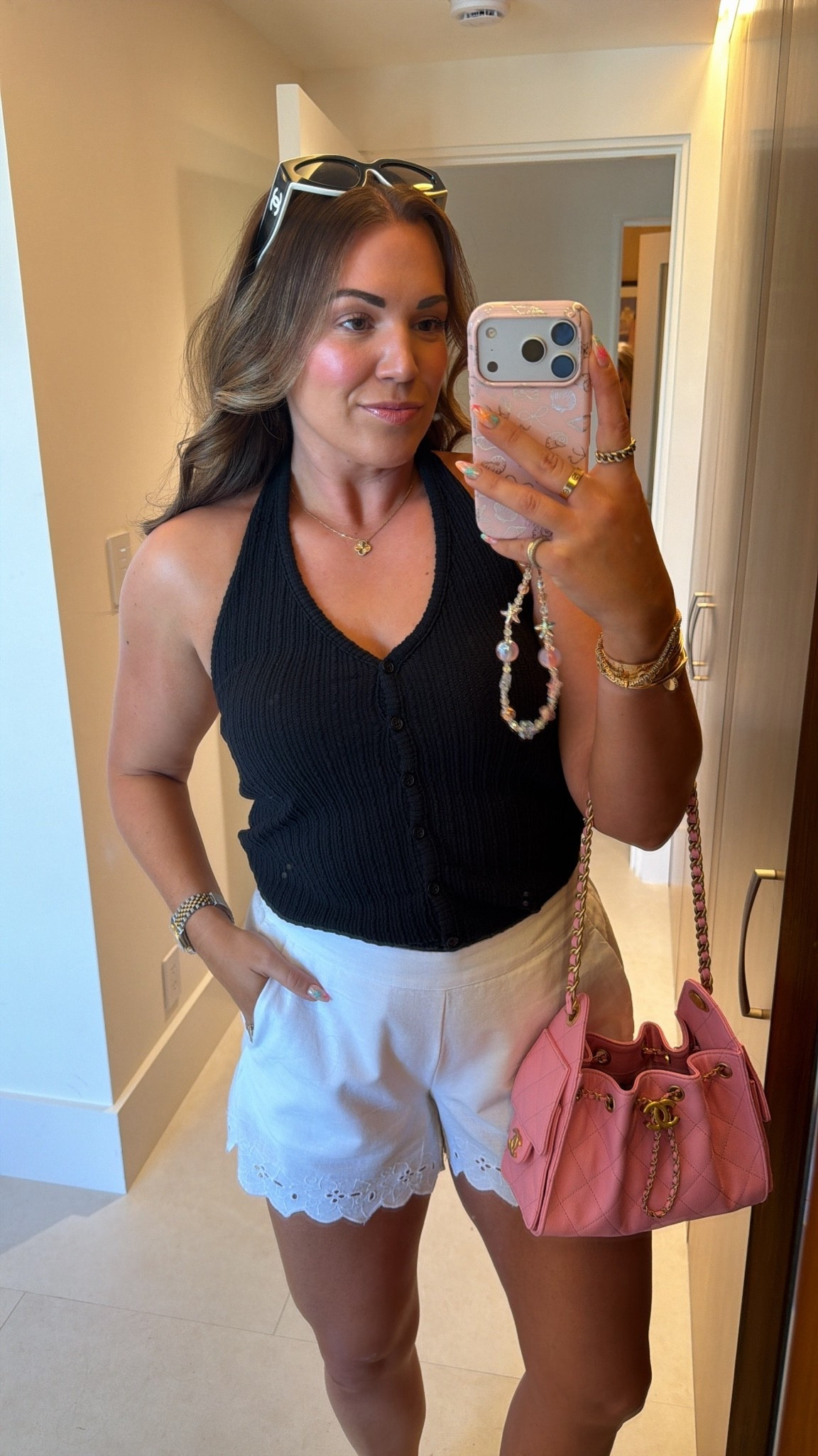 curvy midsize black and white summer outfit! wearing medium in black halter top and white eyelet shorts 🖤🤍

#LTKSeasonal #LTKSwim #LTKTravel