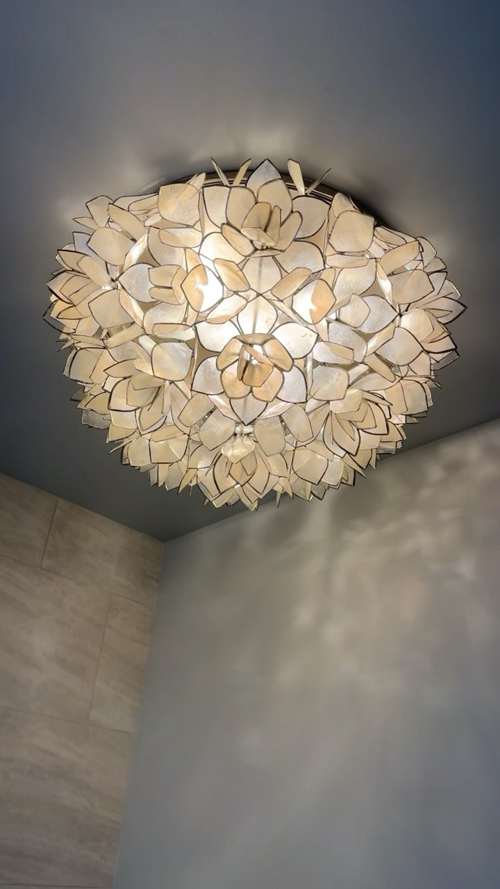 We love this Capiz Flush Mount light for an ensuite! It’s a perfect light for over your tub that adds little femininity but also elegance! ✨
The size shown is the large size. 

#LTKVideo #LTKfamily #LTKhome