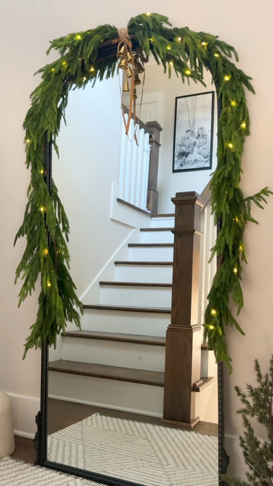✨Decorating my stairwell for Christmas 🎄 

Comment “shop” below for links 🔗 

I made a DIY garland swag for my floor mirror by attaching two (6ft) Norfolk Pine Garland with twine. I then added these adorable small bells, a velvet bow and fairy lights. 

#christmasdecor #garland #holidaydecorating #christmasstairs #mirrorswag #homedecor #interiordesign

#LTKHome #LTKSeasonal #LTKHoliday