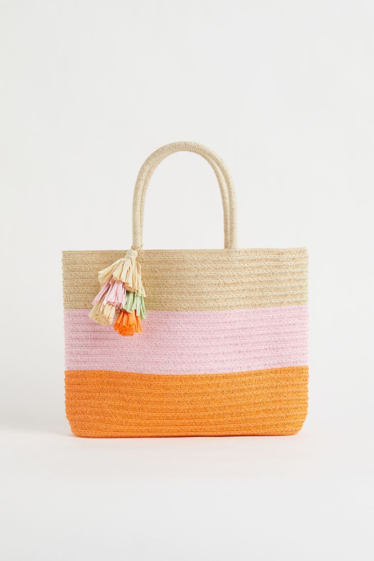 Bag in braided paper straw with handles at the top, one with a decorative tassel. Lined. Depth 7 ... | H&M (US + CA)