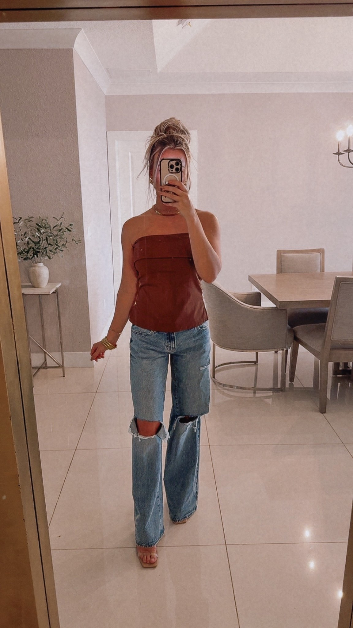 Such a chic fall combo. This strapless top is sleek, structured, and looks so good with denim — easy for date nights, holiday events, or anything dressy-casual.

Top: Wearing a small — true to size. Holds its shape, flattering neckline, stays up well.

Jeans: Same pair — run large. I’m in a 23 for the relaxed, low-rise, semi-baggy fit.

Heels: Linking my fave nude heels again. Neutral, comfy, match everything.

brown strapless top. strapless top outfit. brown top outfit. fall outfit ideas. thanksgiving outfit ideas. holiday casual outfit. christmas casual outfit. holiday outfit ideas. wide leg jeans. low rise jeans. baggy jeans. denim outfit. date night outfit. girls night outfit. amazon fashion finds. amazon top. nude heels outfit. ltk fashion. fall style. everyday style. trending outfits.

#LTKHoliday #LTKCyberWeek #LTKootd