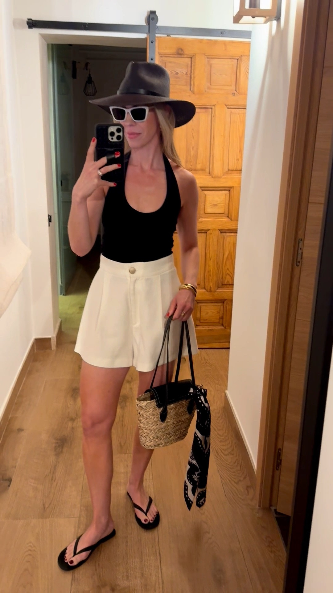 Summer vacation outfit, Euro vacation, black halter top, white linen shorts, leather thong sandals, @Janessa Leone black straw hat

#LTKTravel #LTKSeasonal #LTKOver40