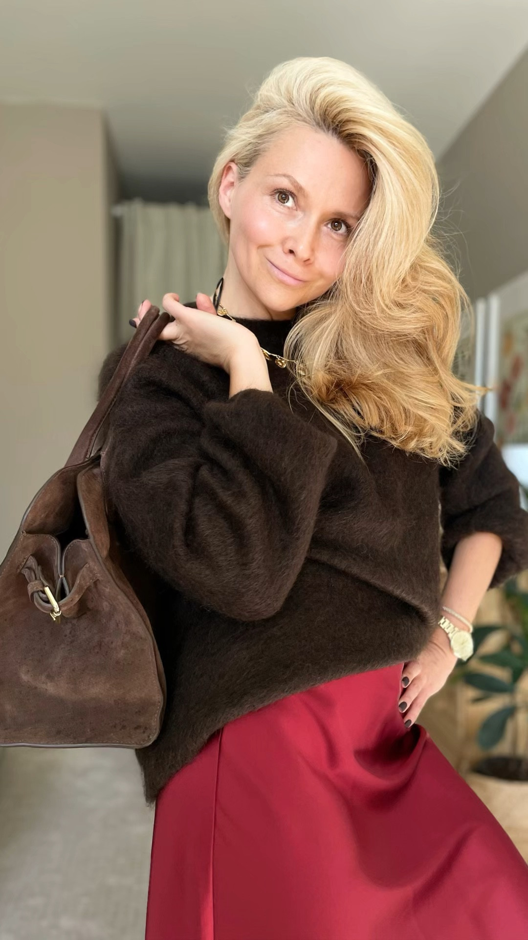 A silk skirt in burgundy paired with a brown mohair sweater creates a gorgeous, rich combination. When styled with chocolate-colored suede boots and a matching suede bag, it’s the perfect blend of luxury and comfort. 

#LTKShoeCrush #LTKWorkwear #LTKStyleTip