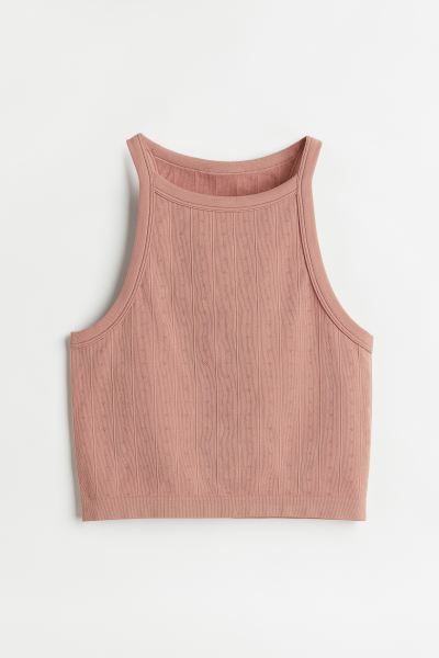 Conscious choice  Sleeveless crop top in pointelle jersey with a narrow cut at top. Designed with... | H&M (US + CA)
