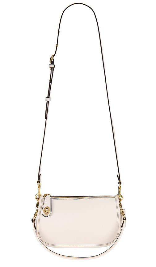 Coach Swinger Bag in Cream. | Revolve Clothing (Global)