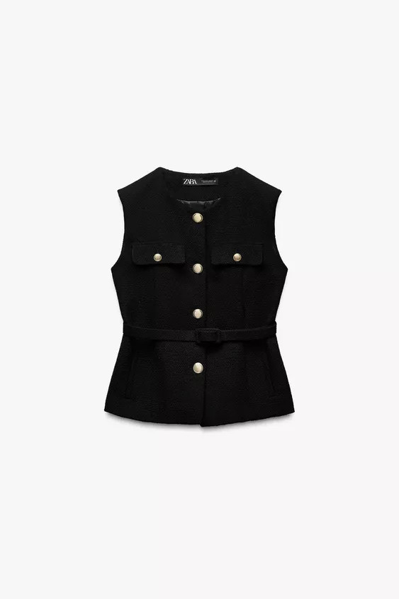 Round neck sleeveless waistcoat. Featuring a matching belt, front mock pockets with flaps, front ... | Zara UK