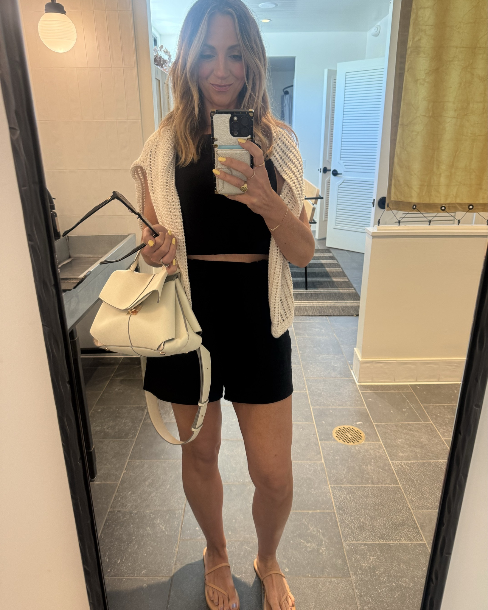 What I actually wear wine tasting in Los Olivos 🍷✨
This black linen short set is hands down my best-selling piece of all time for a reason—it’s lightweight, flattering, and so easy to throw on while still looking put together. Comes in tons of colors and is under $35!

It runs true to size—I’m wearing a medium (I’m 5’7, size 6 for reference). The shorts have a stretchy elastic waistband and deep pockets 🙌🏼 which makes it perfect for all-day wear.

I also have this set in the khaki color and it comes in so many beautiful options. It’s one of those pieces you can mix and match too—so cute styled separately.

Layered it with this crocheted sweater from Target (also wearing a medium) for that relaxed wine country feel—perfect for when it cools off later in the day.

Finished with simple minimal sandals and a designer-inspired woven bag for that effortless, elevated look 🤍

Perfect for wine tasting, weekend getaways, or casual summer days when you want to feel cute and comfortable.