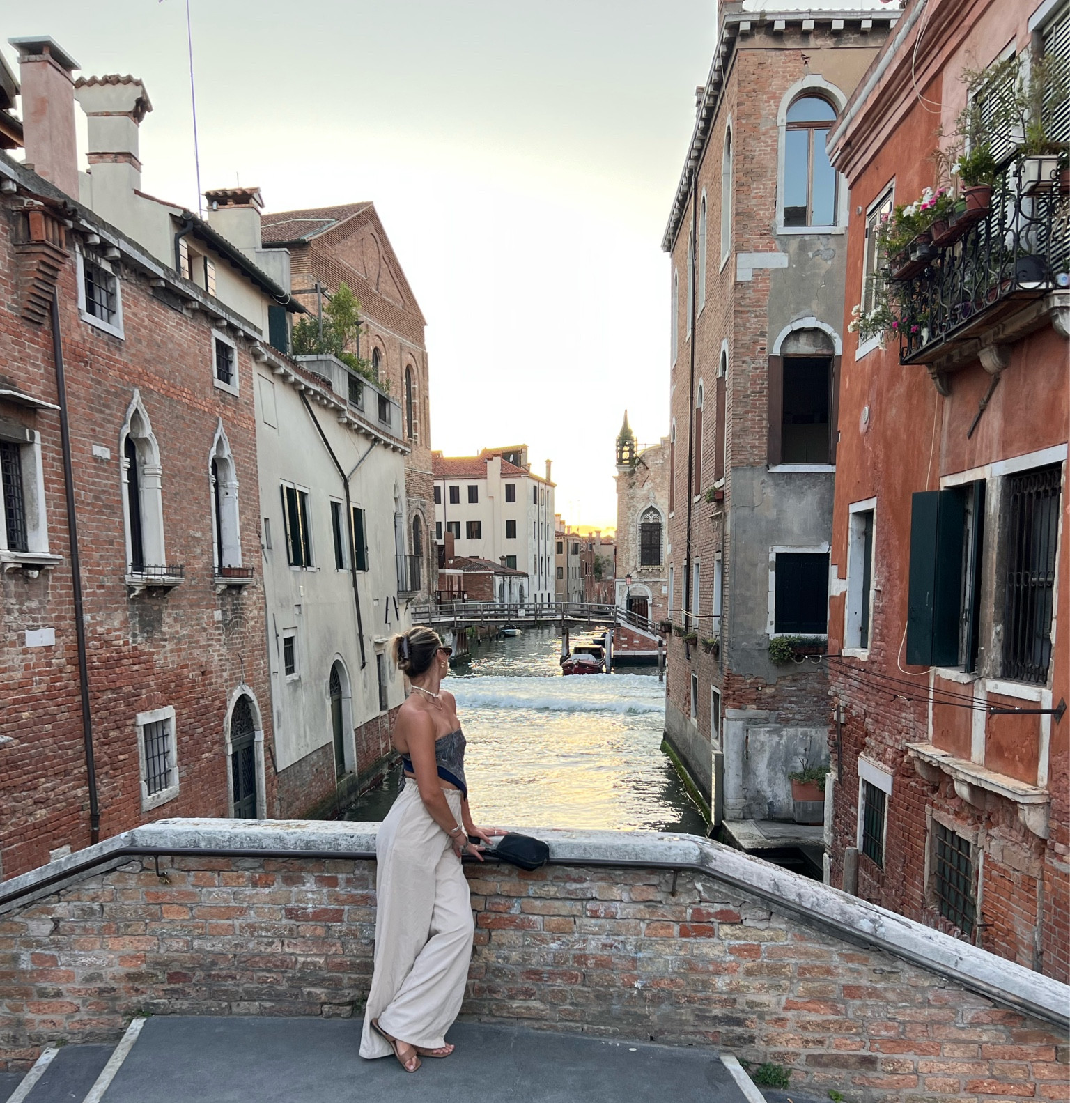 venice, italy 🧡 
the most packable outfit for backpacking and travel. the scarf top is versatile and can be used for so many things (top, on head, & purse) and the pants are a staple 🤎 highly recommend it all 

#LTKtravel #LTKeurope #LTKstyletip