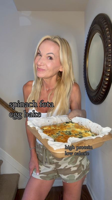 SPINACH FETA EGG BAKE

12 ounce bag frozen chopped spinach, thawed and drained well.  
4 ounces feta crumbles
8 eggs
1 cup 2% cottage cheese (I use Good Culture)
salt, lemon pepper and red pepper flakes  


Preheat oven to 350 and line an 8x8 inch baking pan with parchment paper. 

Make sure spinach is fully drained (you may need to squeeze some water out of it) and spread across bottom of pan. Season the spinach well with lemon pepper and sprinkle feta across evenly. 

Place eggs and cottage cheese in blender. Season with salt and lemon pepper and blend until completely smooth. Pour this mixture over the spinach and feta and bake for 35 minutes, until golden. 

Cut into 6 pieces. Each piece contains 185 calories and 16 grams protein. 

These egg bake recipes are so adaptable. Black olives or roasted peppers would be great additions to this one. 

Are you going to try this?

xoxo
Elizabeth 








#LTKHome #LTKVideo #LTKOver40
