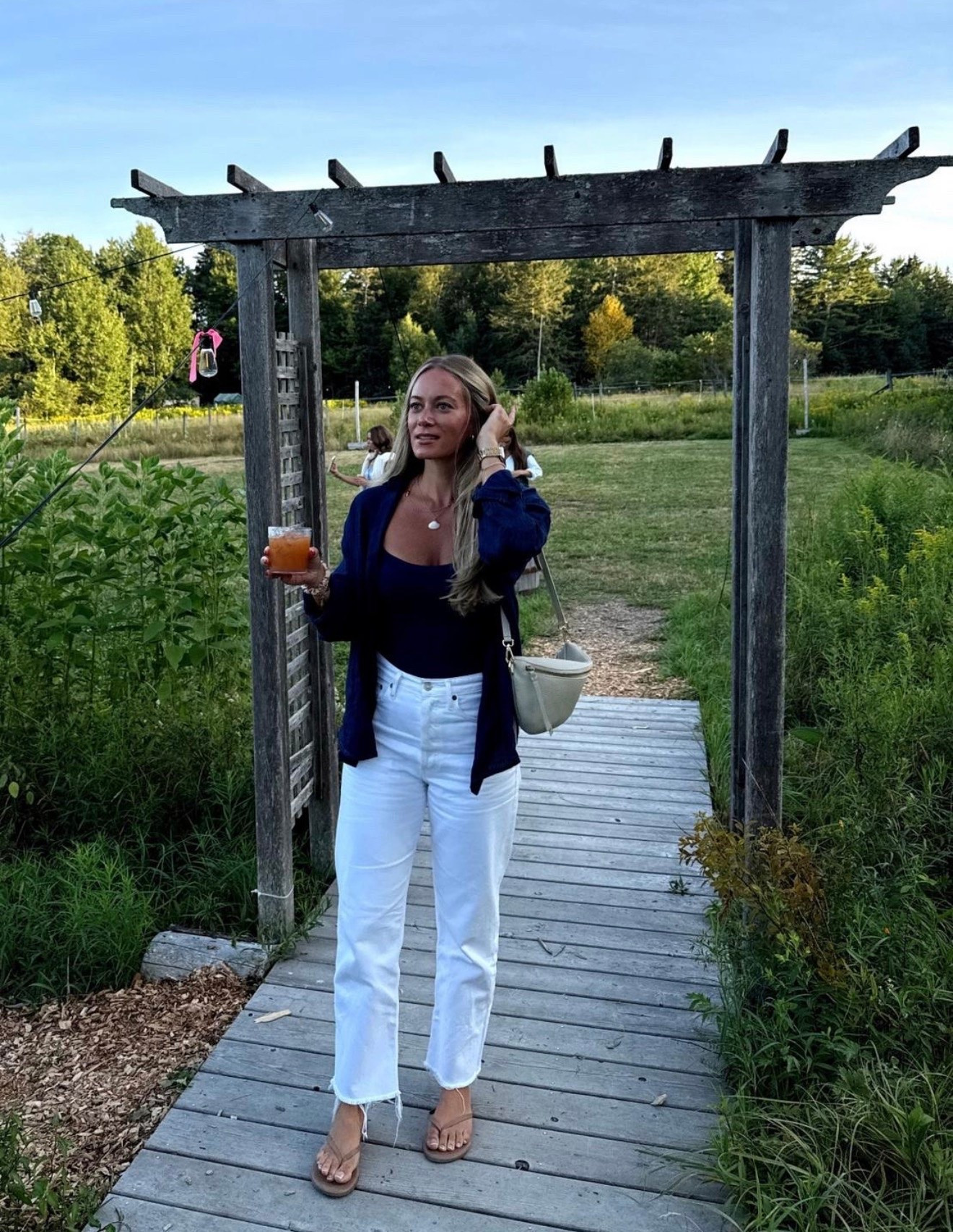 Perfect transitional outfit wearing navy blue button down with padded Amazon tank and the best white jeans

#LTKootd #LTKSeasonal