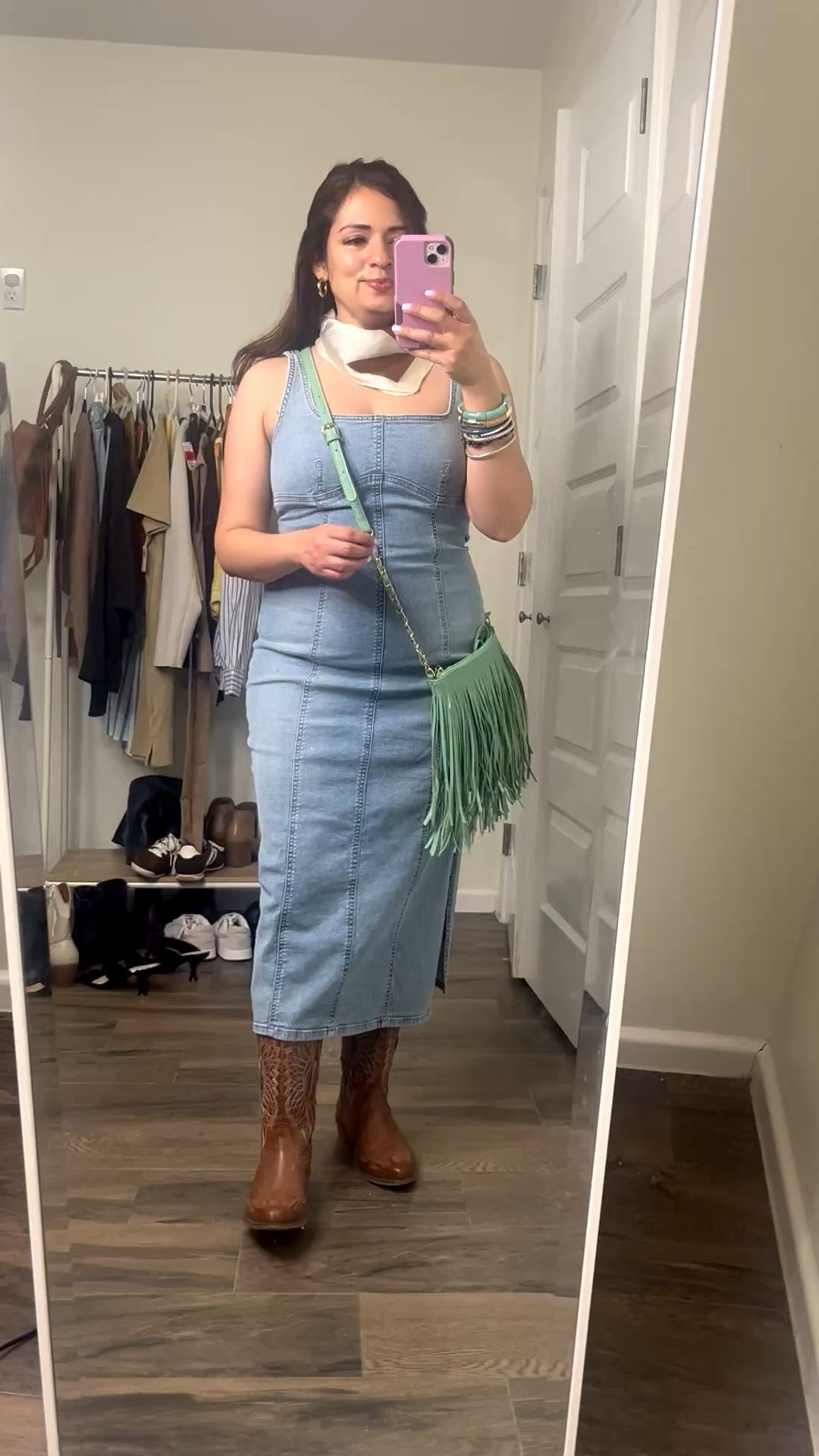 Fringe purse styled with a denim midi dress with cowboy boots 



#LTKFestival