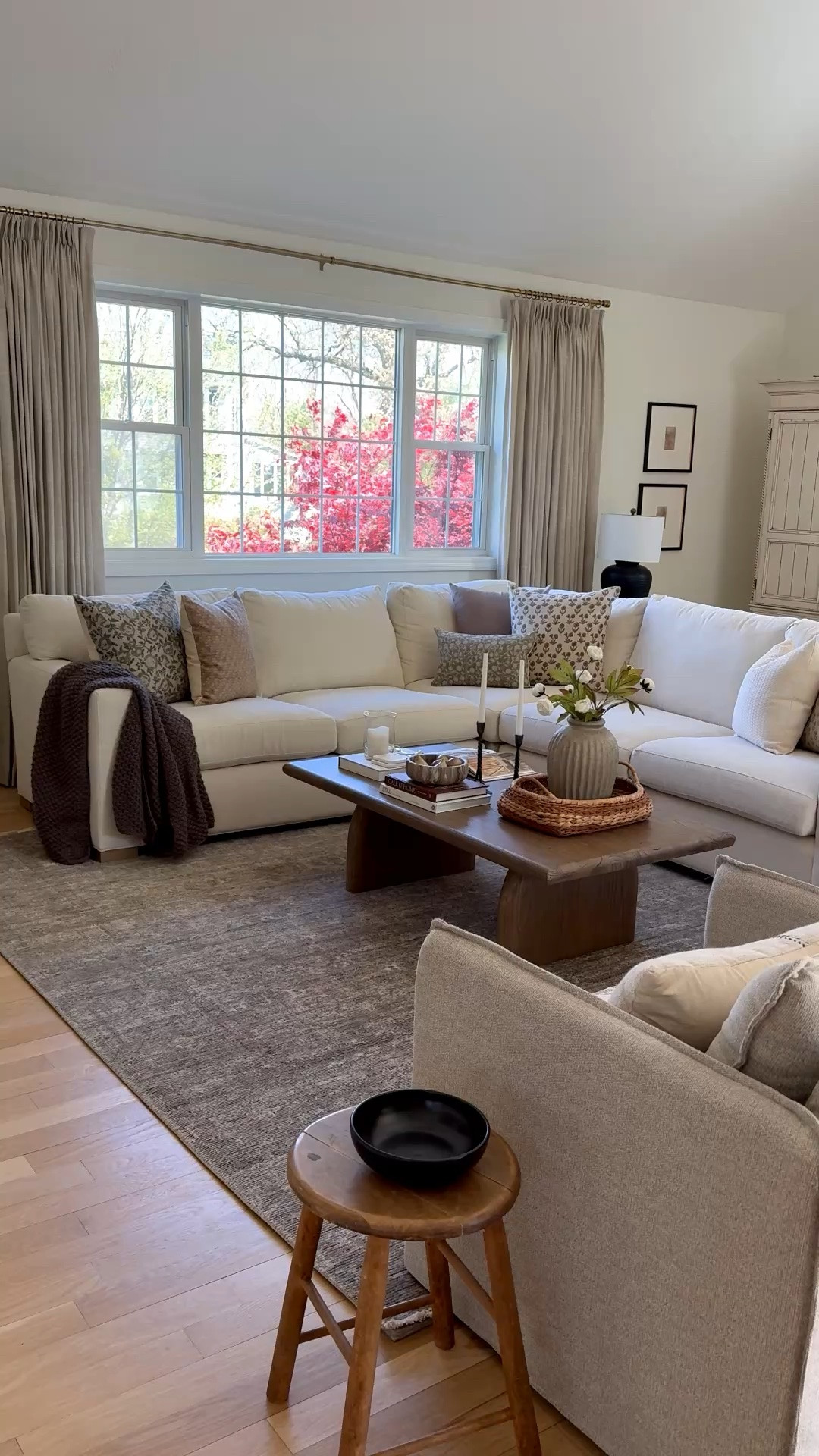 Love how our living room has come together over the last several months. Everything in here is affordable, except for a bit of a splurge on the sofa, but the wood tones add that added warmth and dimension into this large space paired with this beautiful rug!

#LTKHome