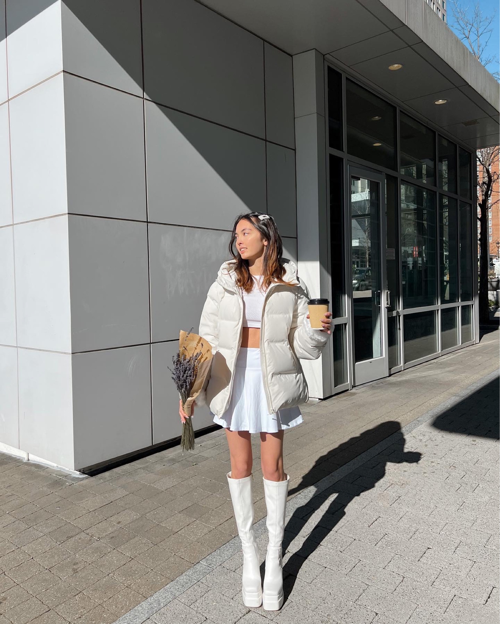 all white outfit white tennis skirt white long sleeve crop top white puffer jacket cream puffer jacket white platform boots spring skirt spring boots thigh high boots knee high boots