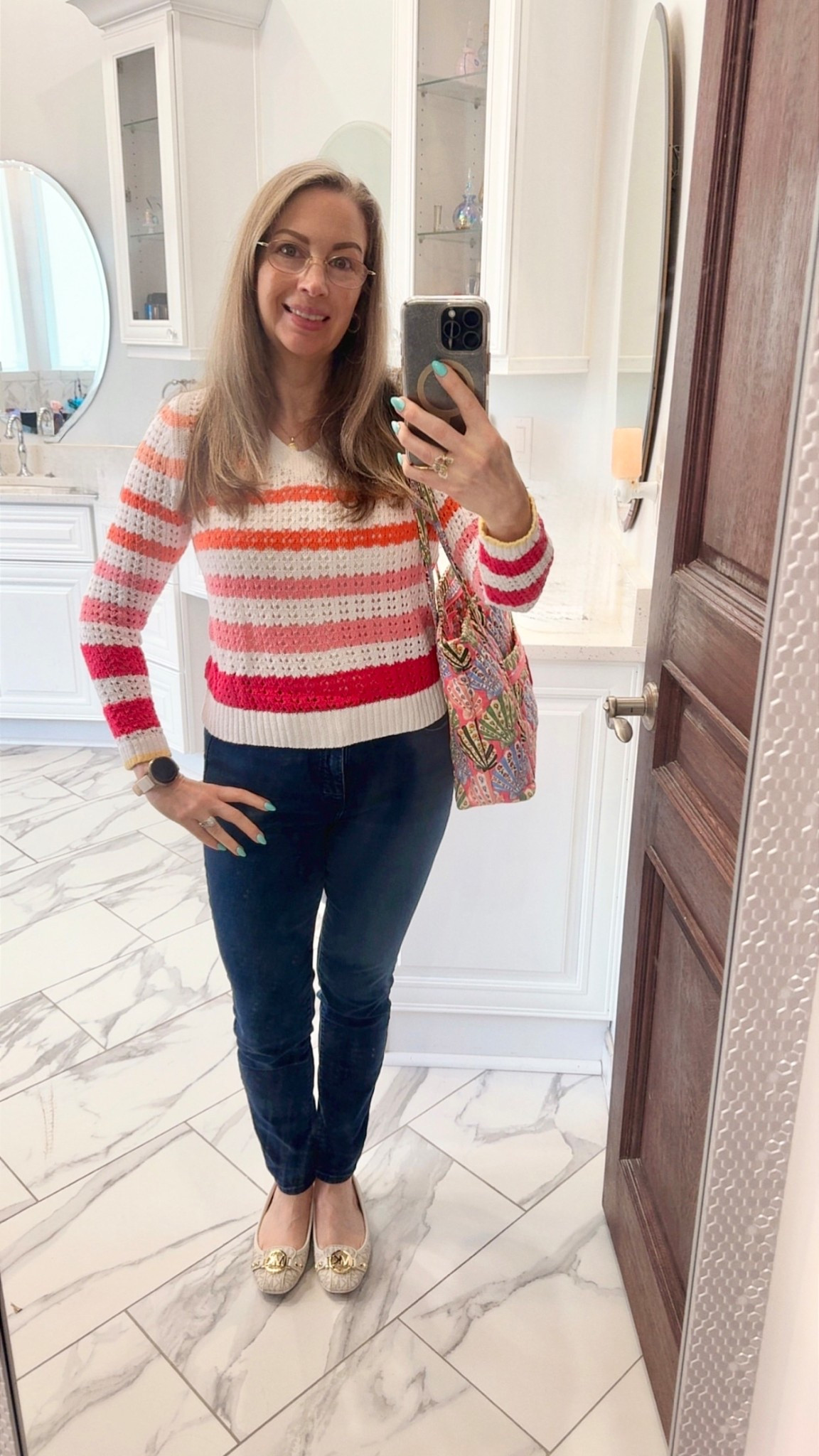 ￼ This weather is crazy! One day, we're in sundresses and shorts; the next, we're bundled up in sweatshirts, sweaters, and sweatpants. By the time I bought this sweater, I only got to wear it once, so I’m putting it on again before the temps skyrocket. Patterns aren’t something I wear often, but I love stripes—and now my new tote. The colors in my closet are harmonious, so I was able to mix two patterns without feeling overwhelmed. And it has a lot to do with the scale of the patterns as well. Do you mix your patterns?

￼ Oh, and no makeup today. I’m headed to the optometrist. It’s time for me to get a new pair of glasses. I’m super excited because I’ve been wearing these forever!

#LTKootd #LTKOver40 #LTKSaleAlert