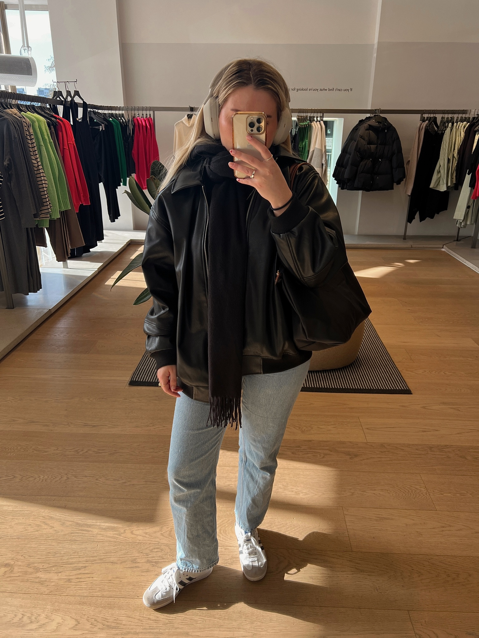 a classic casual outfit with an oversized collar bomber leather jacket, straight leg jeans, adidas samba trainers, longchamp le pliage tote bag and sony headphones

#LTKstyletip #LTKeurope