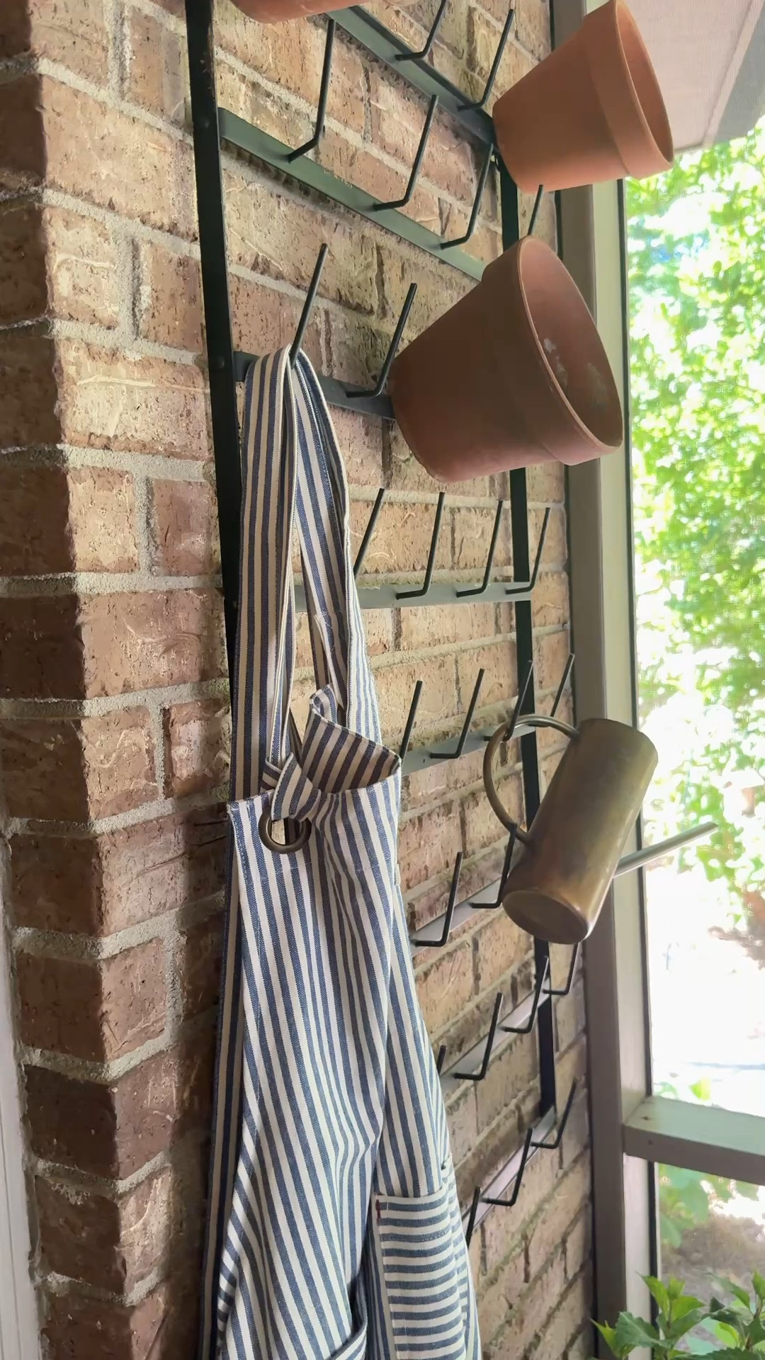 Cozy spring porch with essentials used as decor. Blue and white ticking stripe apron brass watering can vintage terra cotta pots mug rack endless hydrangeaas

#LTKHome #LTKMothersDay #LTKSeasonal