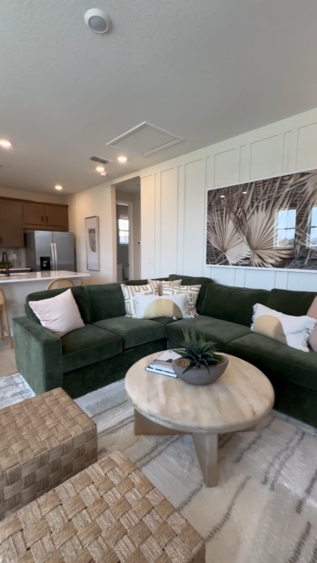 Modern organic decor in this open loft space with emerald green sectional, neutral rug and woven ottoman 

#LTKStyleTip #LTKHome