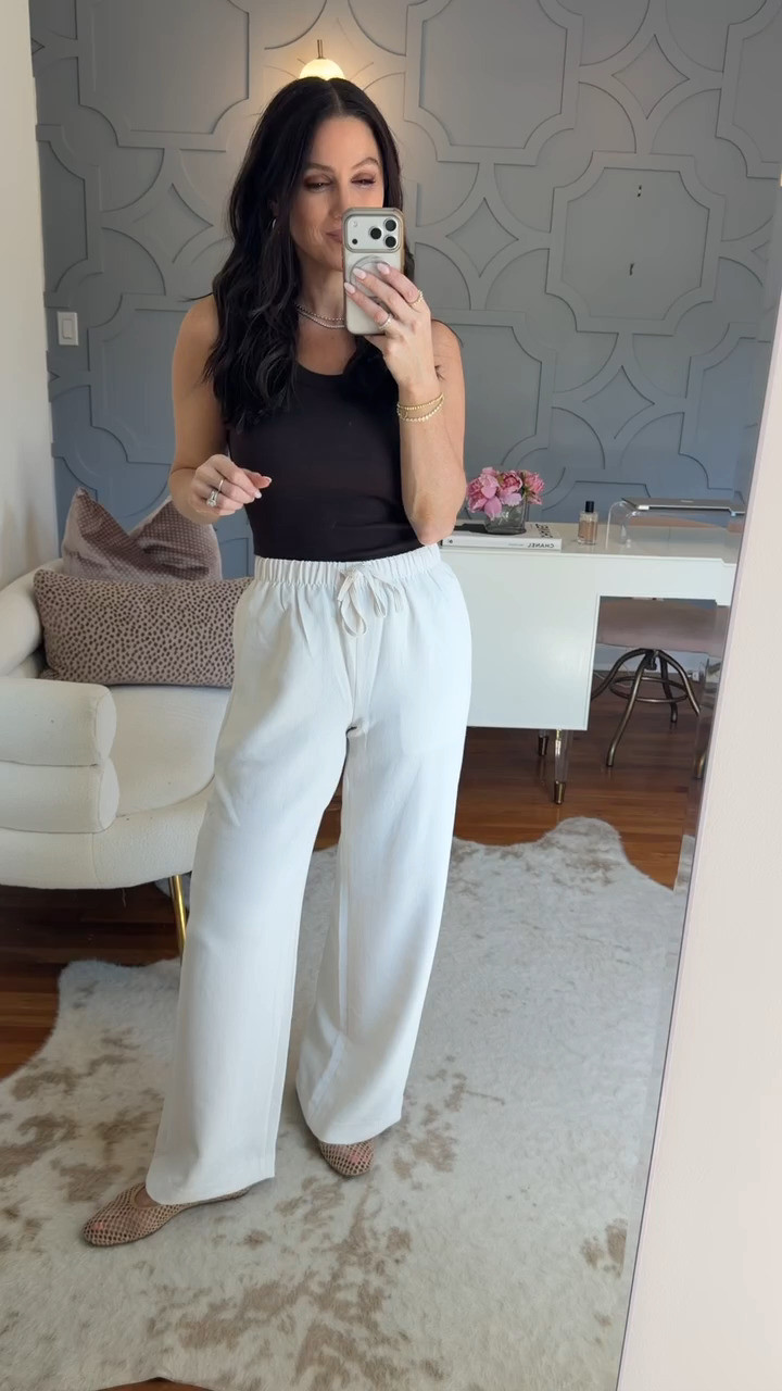 A black tank instantly elevates these wide-leg pants for a sleek, easy outfit that works day to night. True to size in both pieces.

Aritzia Summer 2026 • Stylist Picks • Effortless Everyday Looks 

 #LTKootd #LTKSeasonal #LTKOver40