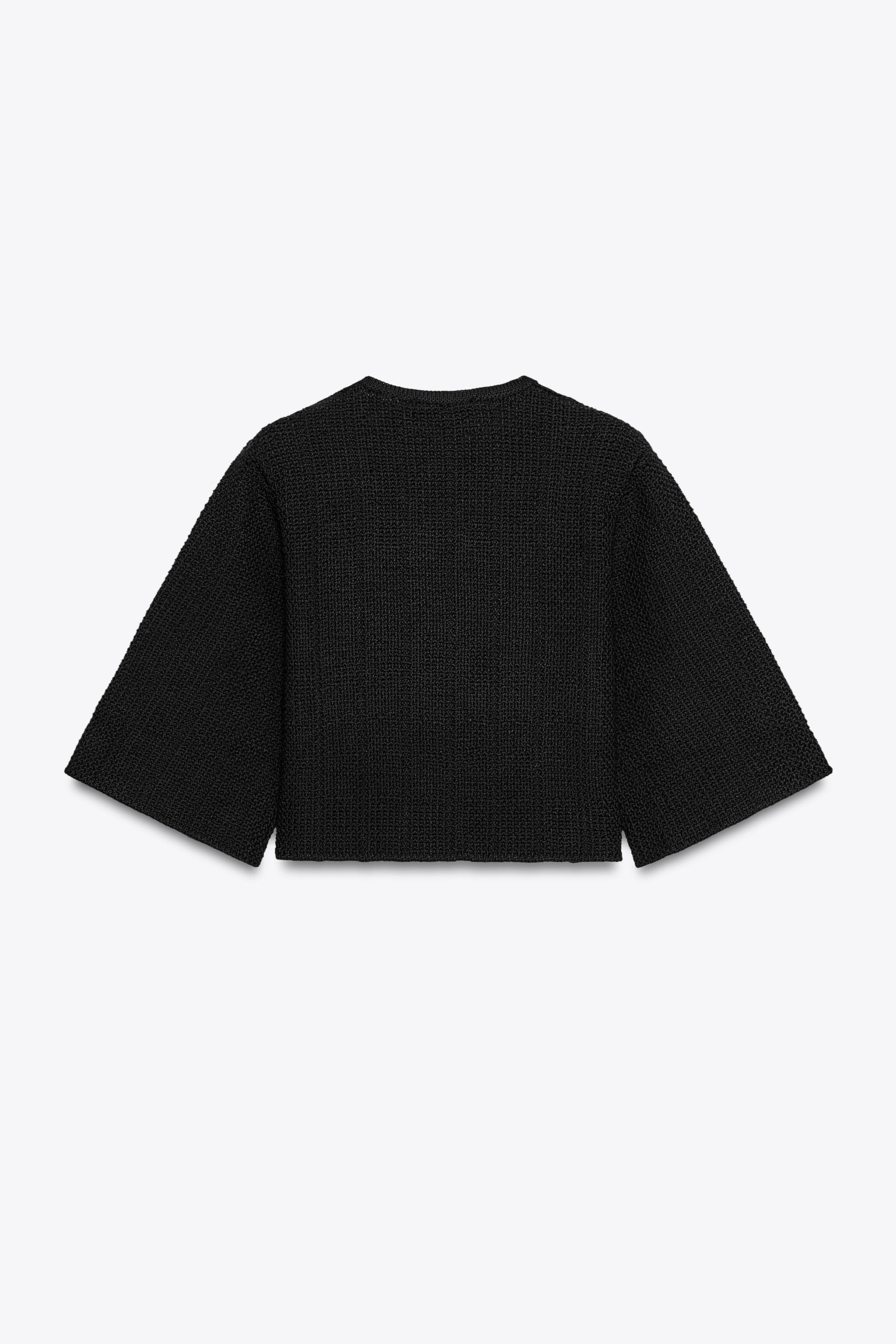 Round neck, short sleeve cardigan. Flared hem. Front closure with matching covered buttons. | Zara US