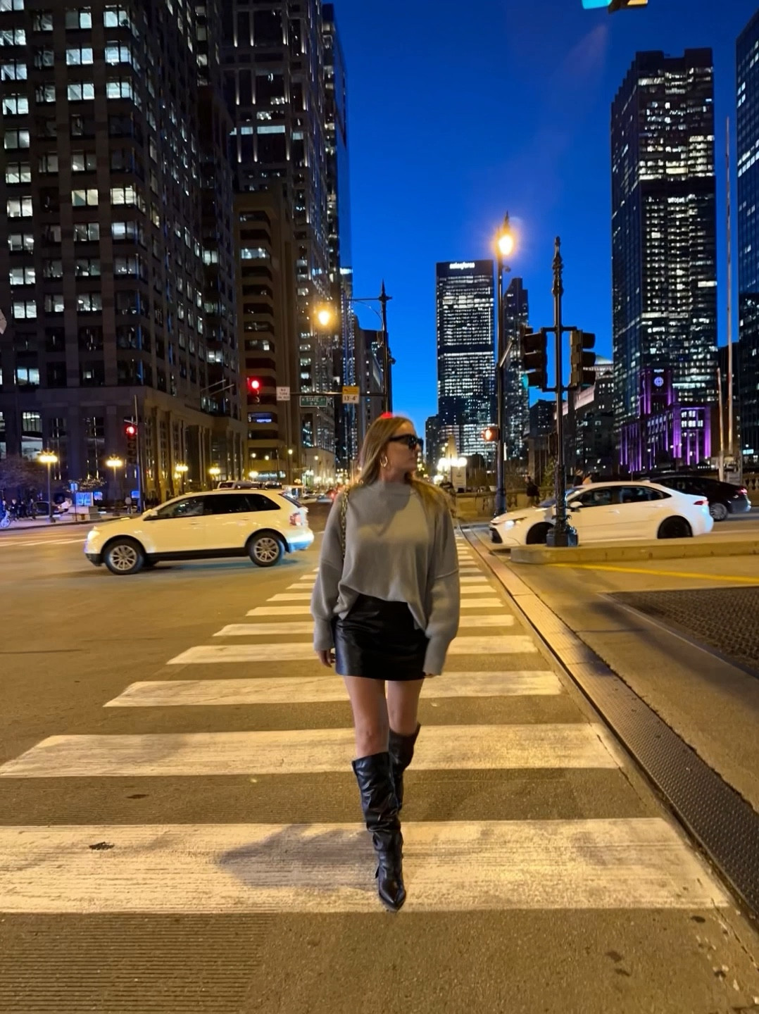 Oversized grey sweater size M
Black boots size 8
Leather skirt size S 
Black bag 
Black sunglasses 
VICI, Target, Amazon 

Use code ELENASAVE25 for 25% off at VICIcollection.com