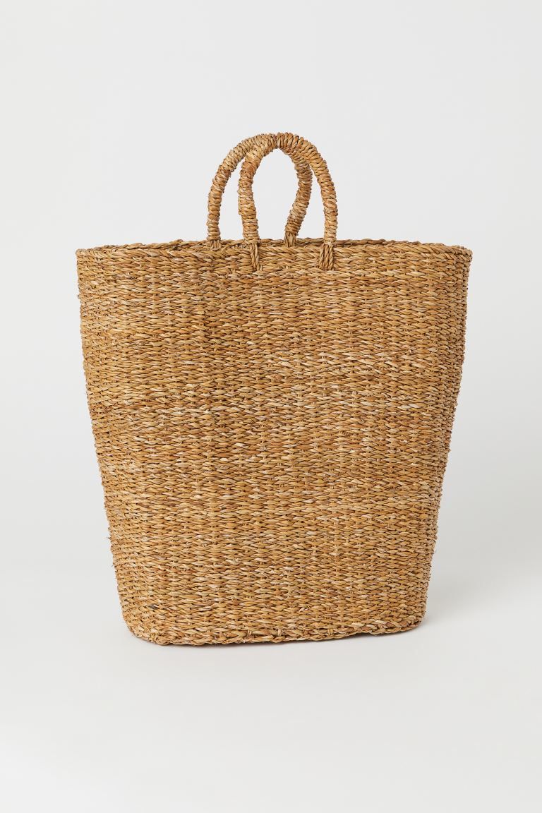 Handmade laundry basket in braided seagrass with two handles at top. Lined. Height 19 3/4 in. Wid... | H&M (US)