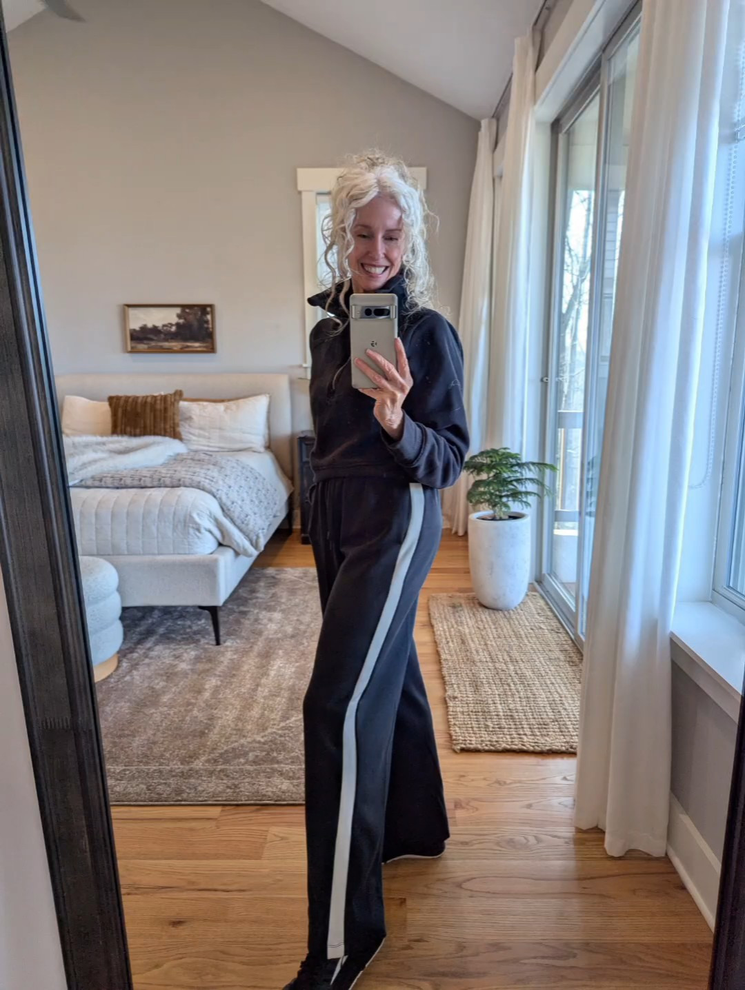 These side striped pull-on track pants + half-zip are a great comfy, polished combo. Also Altra sneakers have been a lifesaver for this little bout of plantar fasciitis! Wearing XS in both #over60 #fashionover50 #plantarfasciitis 

#LTKootd #LTKOver40 #LTKFindsUnder50
