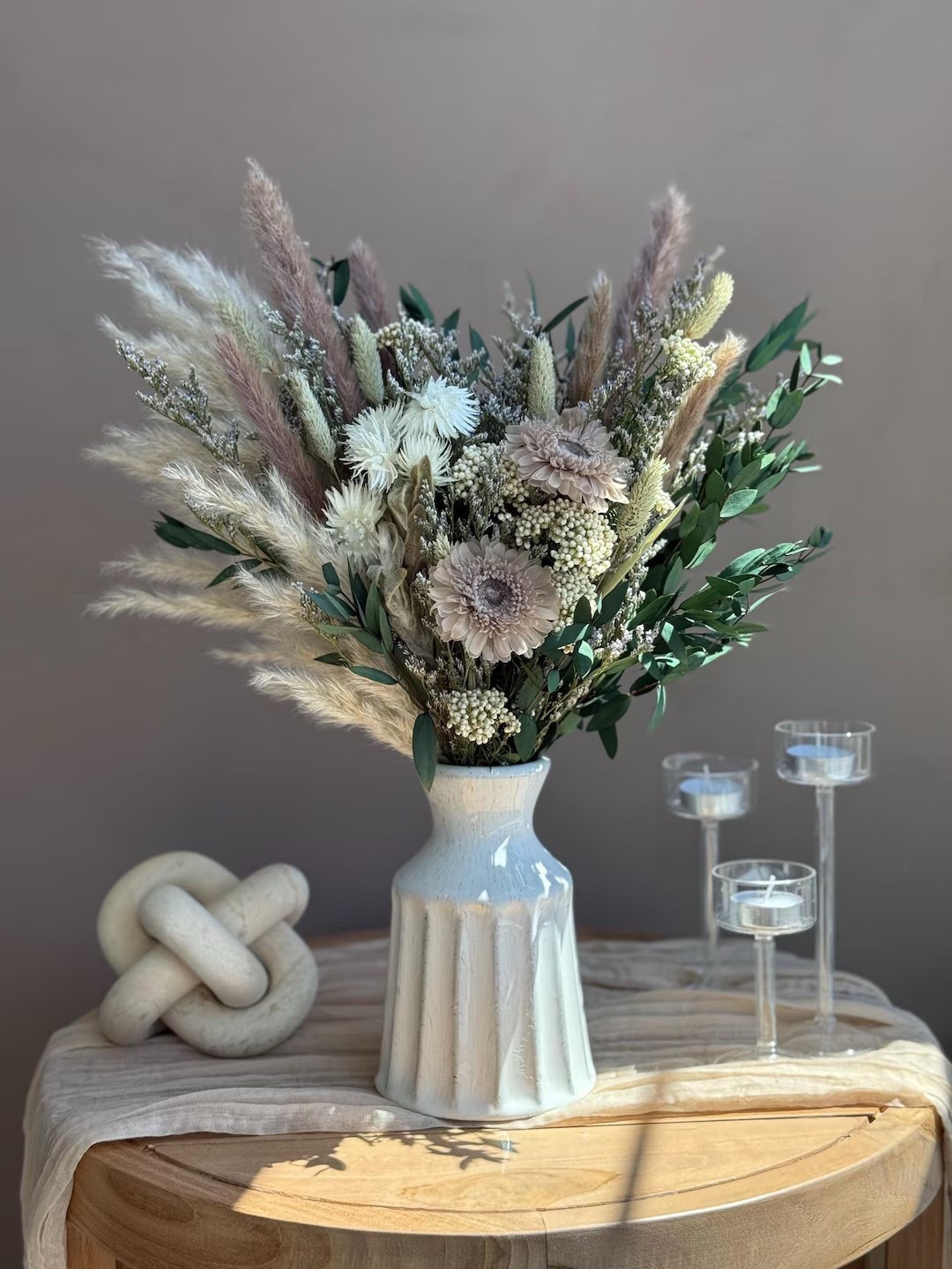 Elevate your space with the sculptural beauty of the Haze dried flower bouquet by EverdriedBloom. Designed with a striking wing-like silhouette, this one-sided arrangement blends limonium, eucalyptus, pampas grasses, rabbit tails, preserved rose flowers, and gerbera for a soft palette of earthy neutrals. The asymmetrical shape creates graceful movement while still feeling calm and grounded—perfect for styling in modern, rustic, or minimalist interiors. Shipped from North Carolina, it’s a timeless decor piece and a thoughtful gift that brings natural texture and elegance to any room.

#LTKhome #driedflowers #pampasgrassdecor #neutraldecor #bohodecor #homedecorinspo #naturalhome #everlastingflowers #ltkstyle #modernrustic

#LTKSpringSale #LTKHome #LTKSeasonal