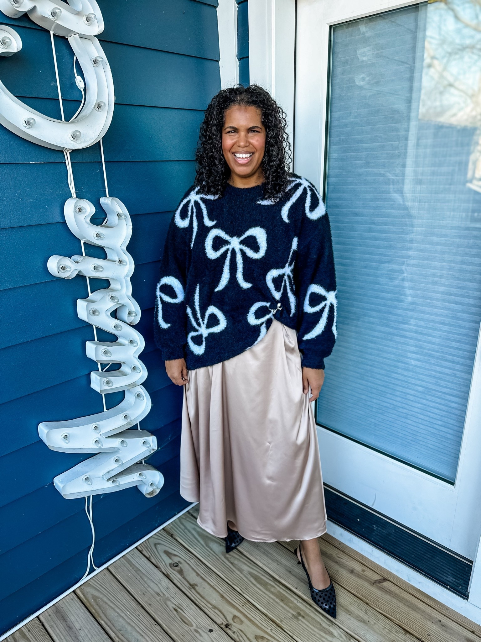 The softest holiday bow sweater, nice and oversized and available in plus sizes too. Clipped up with the sweetest bow pin. I’m wearing a 2x in sweater and xl in skirt (which works for plus). Also linking another favorite skirt that arrives sooner and is available through size 3x. 

#LTKHoliday #LTKPlusSize #LTKOver40