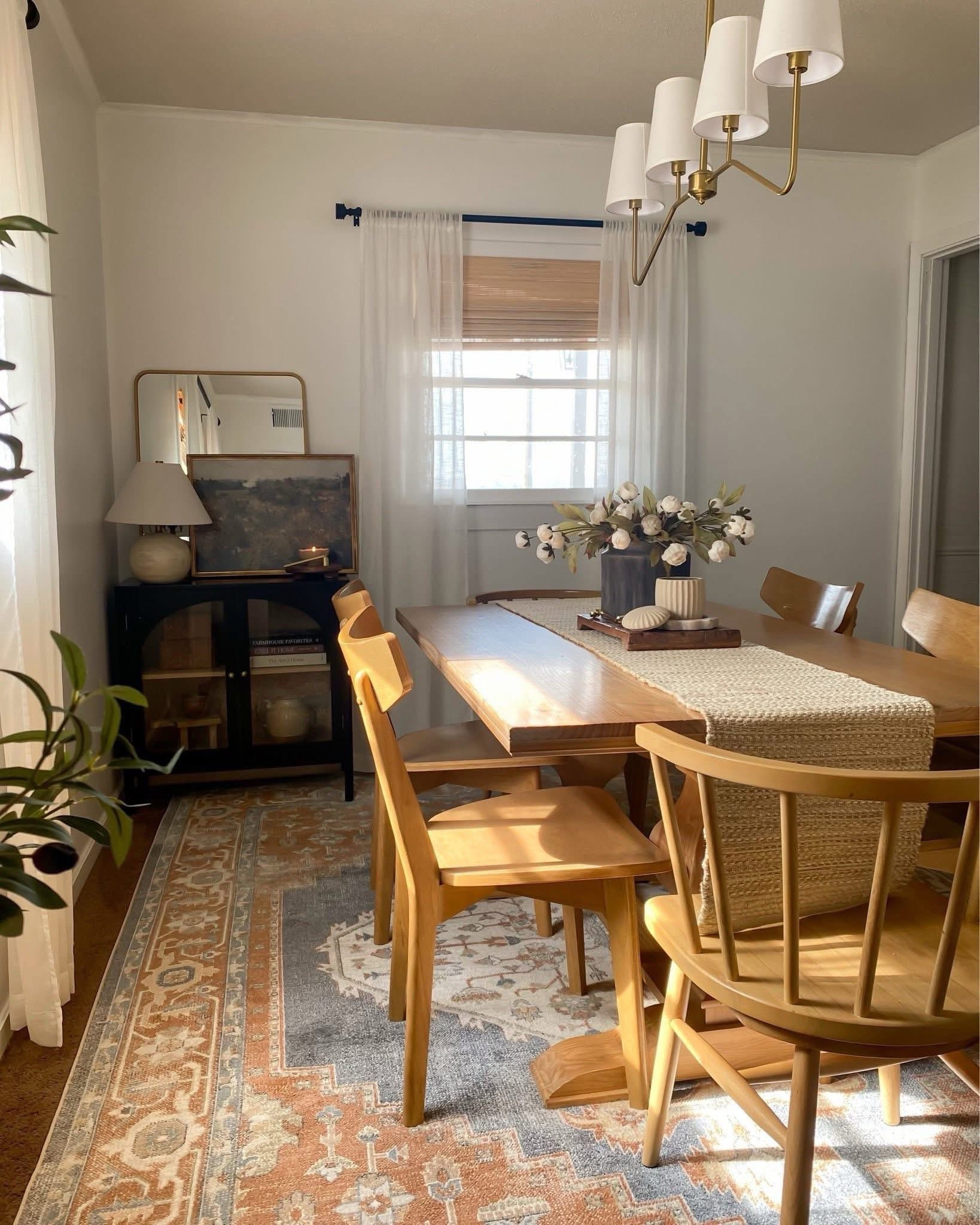 Dining room views ✨ Dining table decor, vintage rug, arch cabinet, Bedford cabinet, linear pendant light, peonies, natural wood dining table, landscape art, wooden pedestal, roman shades, dining table centerpiece

#LTKSeasonal #LTKHome #LTKSaleAlert