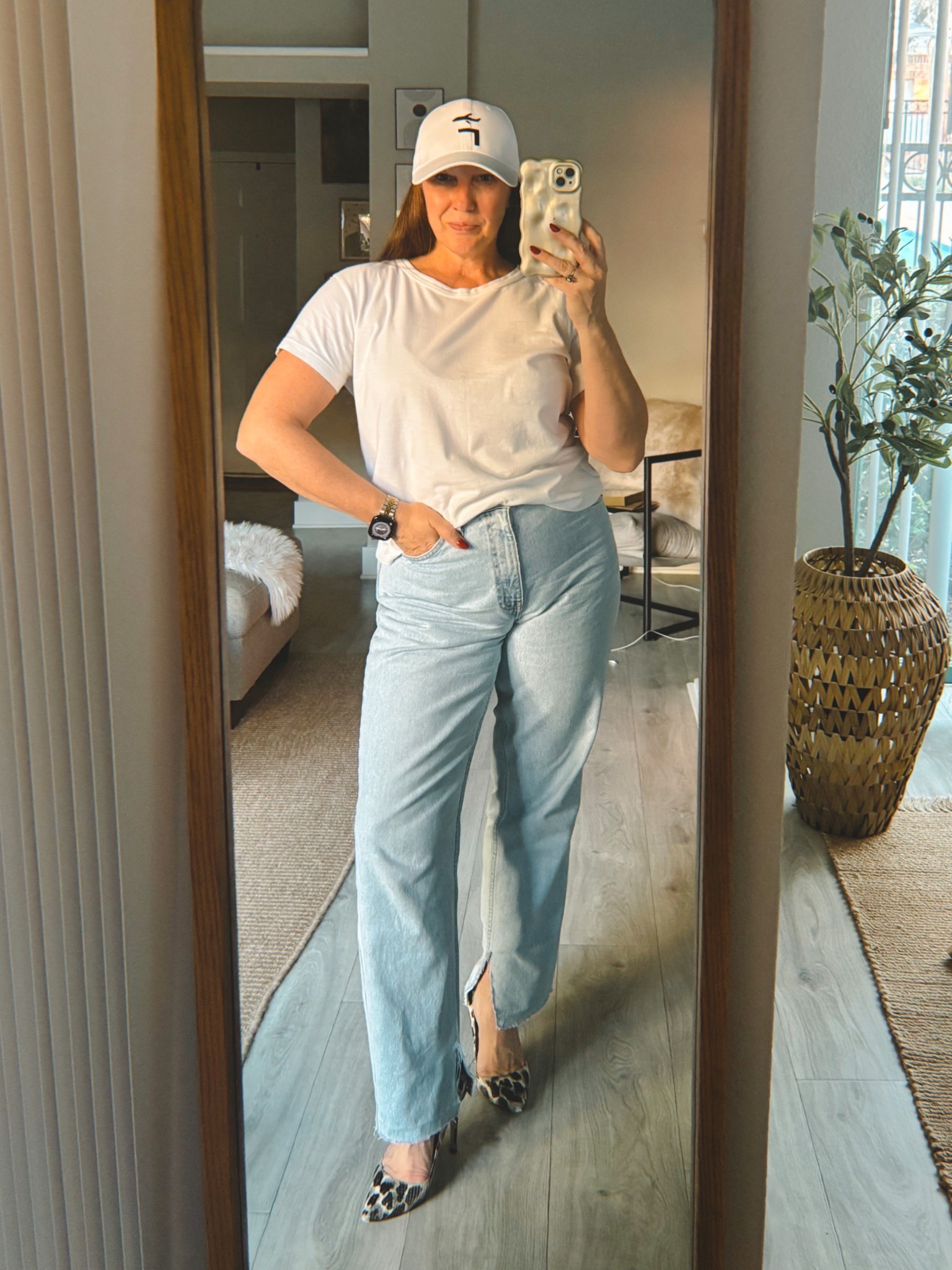 Heels and baseball caps. Light blue jeans. Jeans and a white tee. The most perfect white tee. Weekend style. weekend outfits. 

#LTKMidsize #LTKOver40 #LTKStyleTip