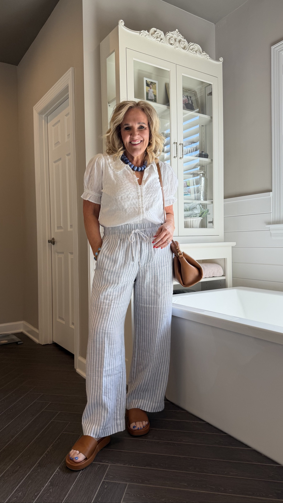 Top size medium 
Striped linen pants size medium inseam 28. 4 lengths available. 
New purse is fantastic!

#LTKOver40 #LTKWorkwear #LTKSeasonal