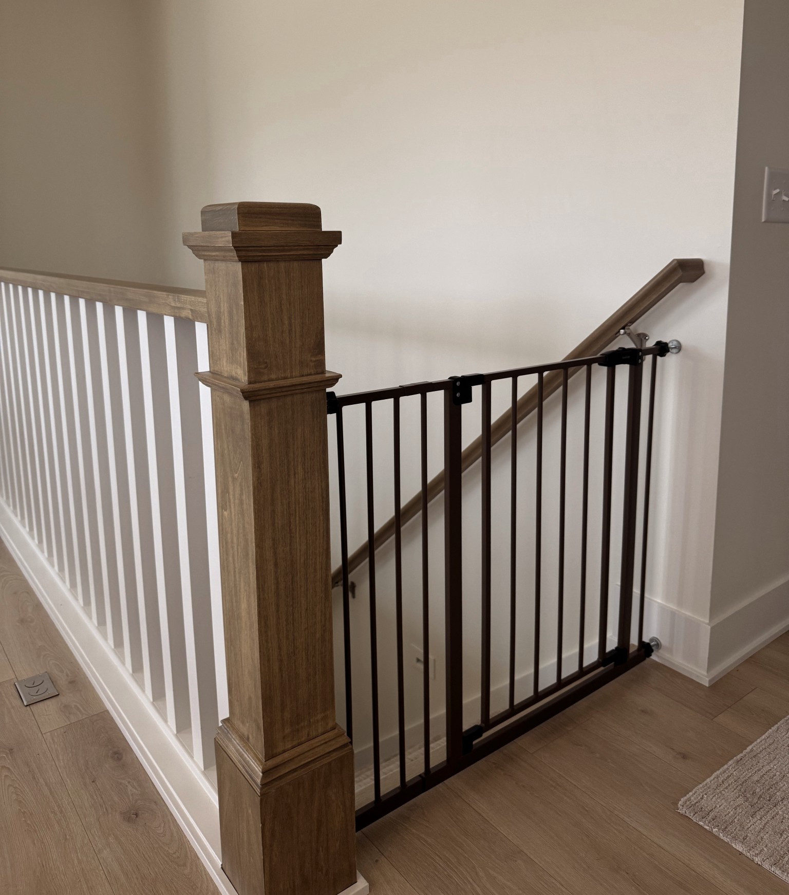 a baby/dog gate was essential when moving + loving this gate with our wood railing 🤌🏼

#LTKSaleAlert #LTKHome #LTKmomlife