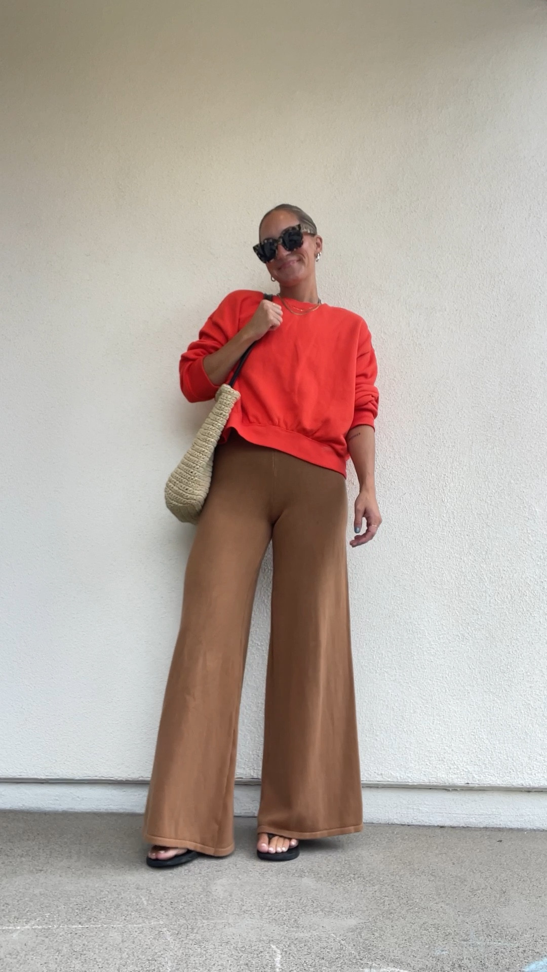 medium in the sweatshirt. thrifted bag. pants are Raised by Water  